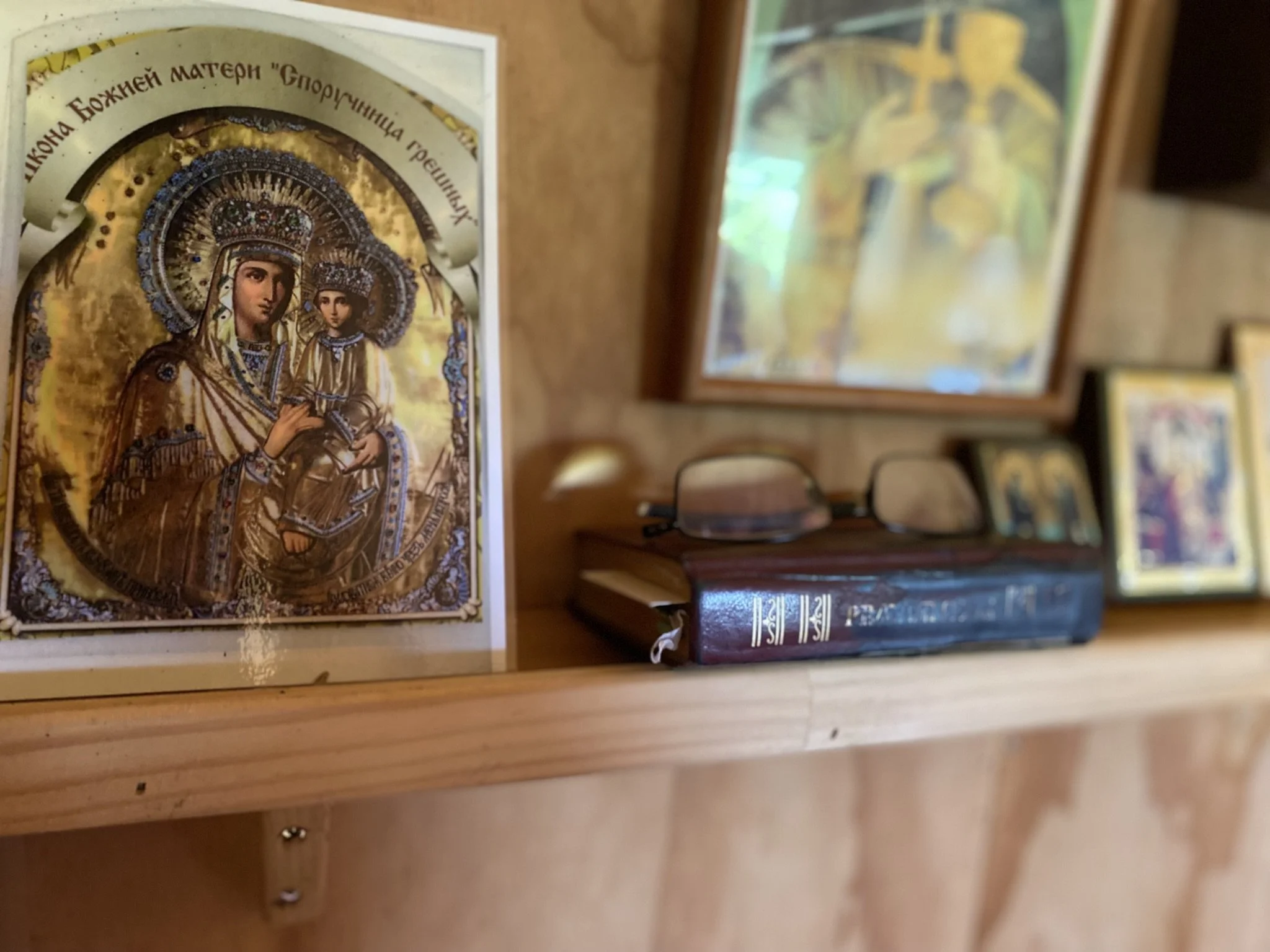 Icon and books inside Sts Cyprian & Justina Orthodox Church in Auckland, New Zealand