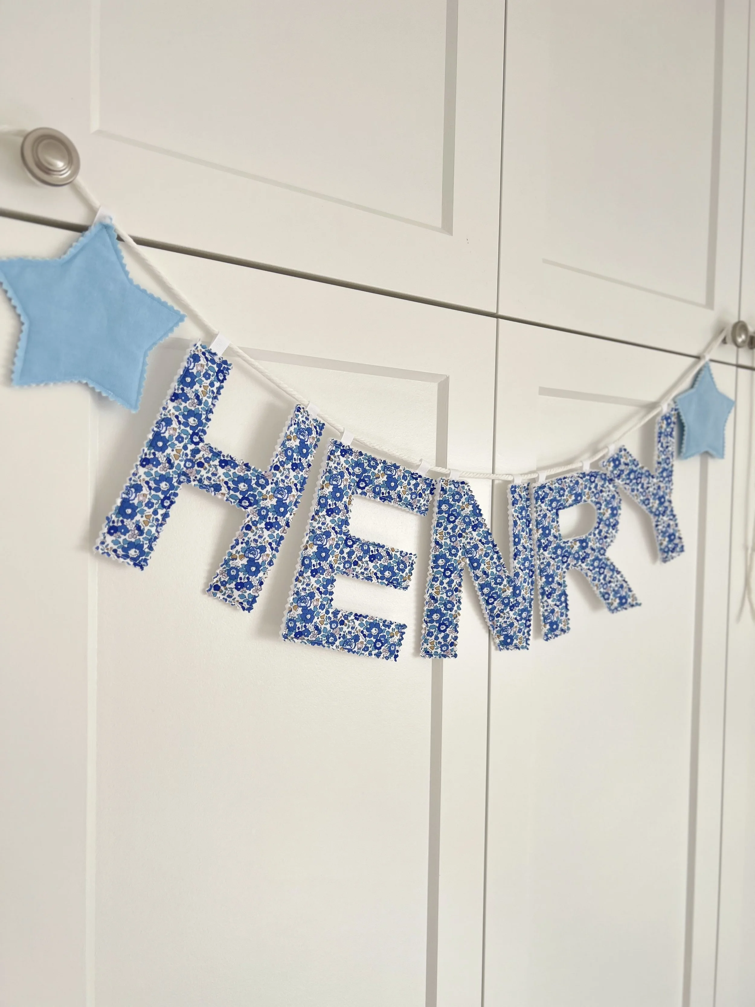 Name banner hanging Henry.jpeg (Copy)