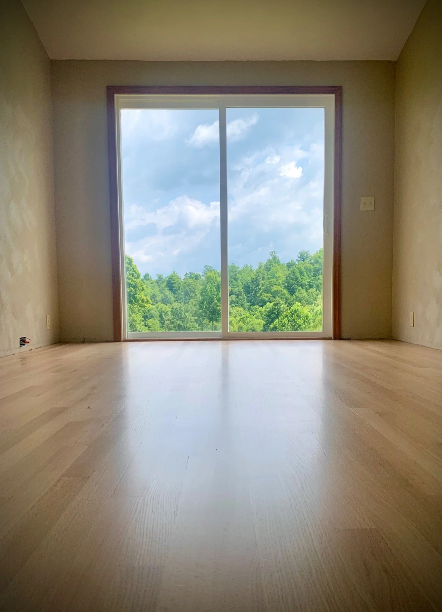 Glass-flat rift and quartered red oak hardwood floor, expertly installed, sanded and finished in Summersville, West Virginia, by Goodman Custom Flooring.