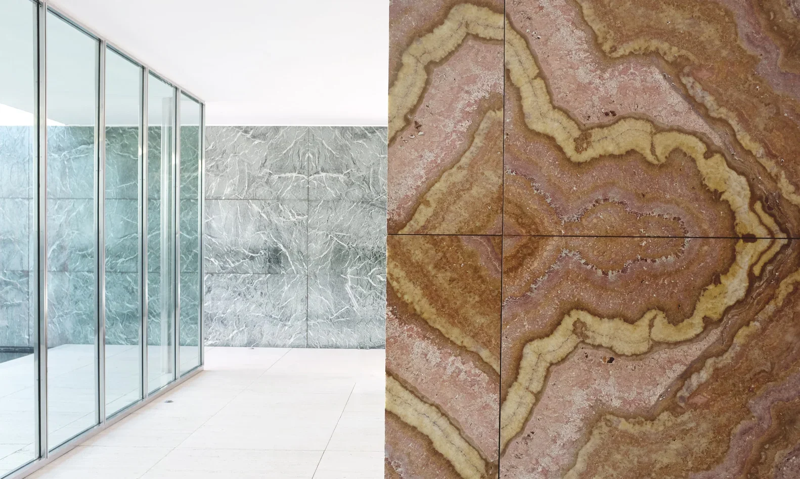Interior space with glass panels and bookmatched marble walls