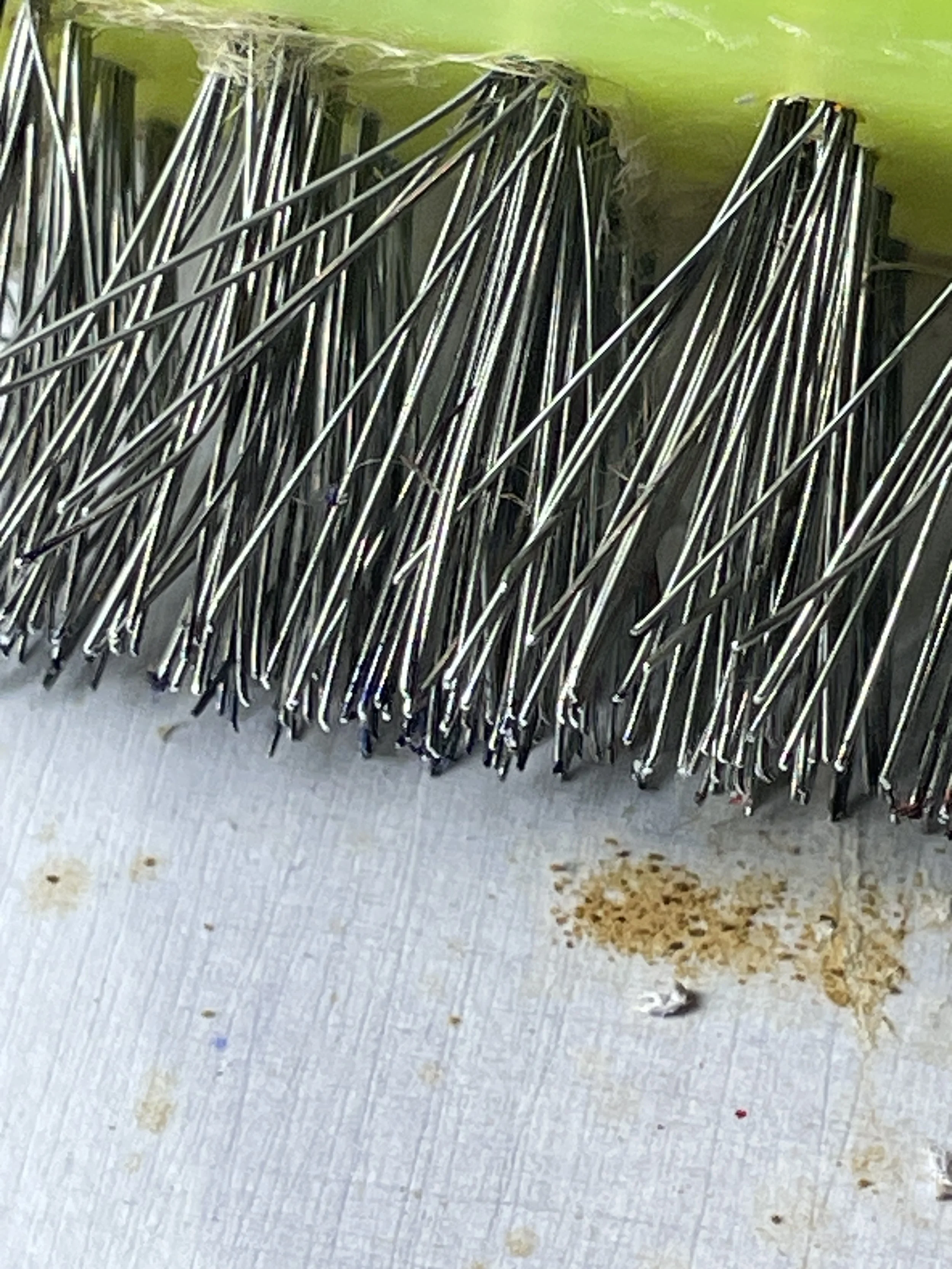 Close-up of a wire brush used during the development of a material-based artwork.