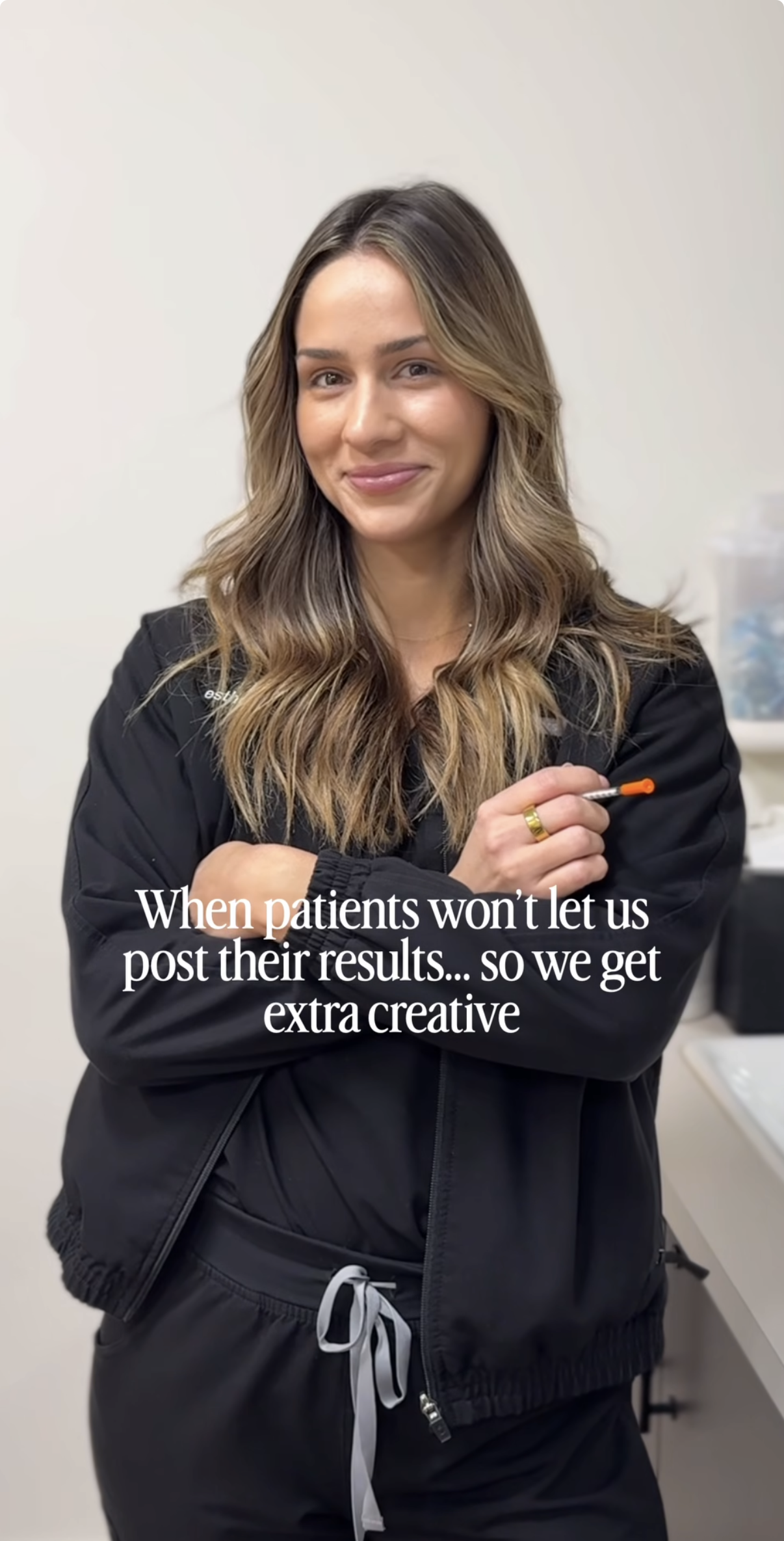 A woman with wavy brown hair and a black jacket smiling, holding a swab in her hand, in a medical or clinical setting with a caption about getting creative with results.