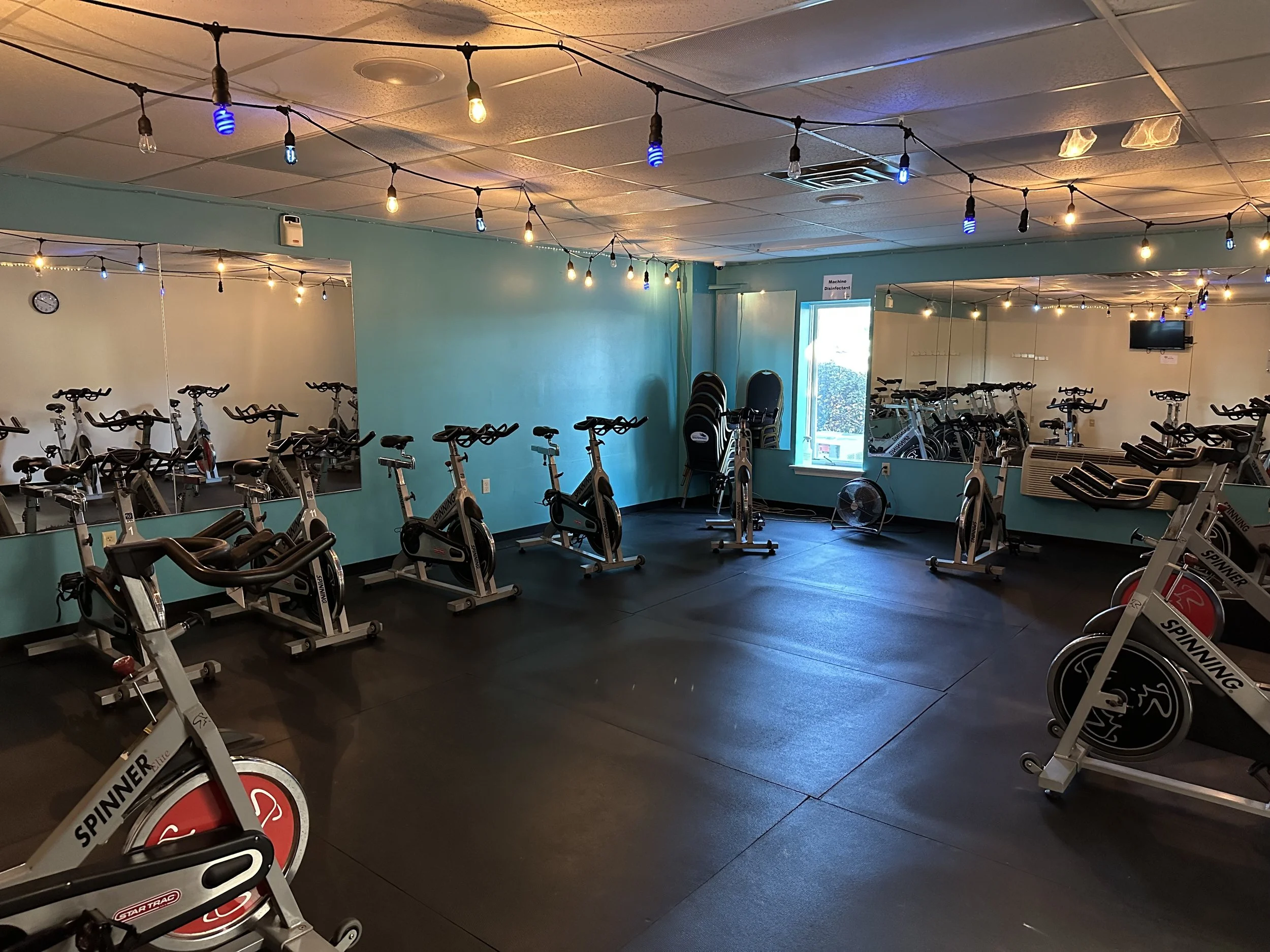 Elverson Fitness Club (Elverson, PA) features an indoor gym with stationary bikes, mirrored wall, used for dance and cardio classes