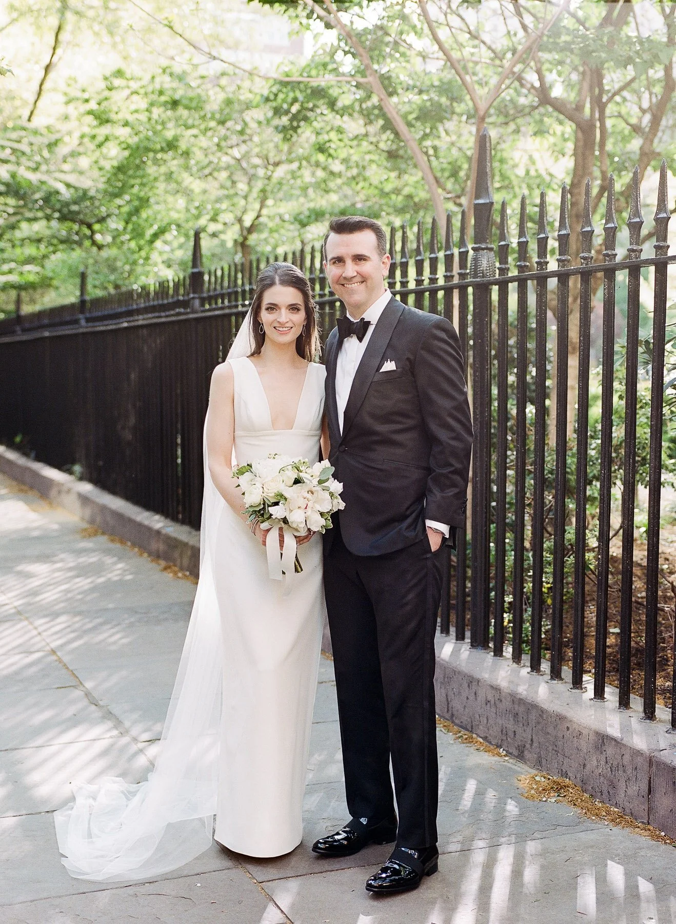 Gramercy Park wedding photos featuring Sarah Seven wedding dress and Tom James Tux