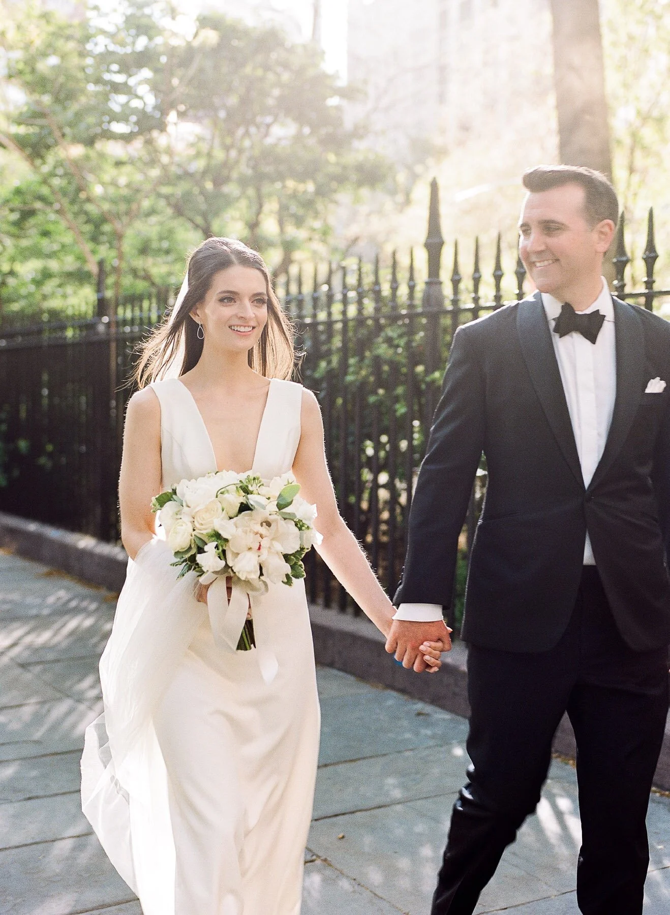 Gramercy Park wedding photos featuring Sarah Seven wedding dress and Tom James Tux