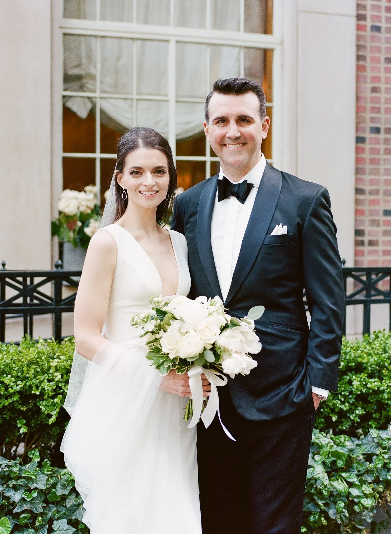 Gramercy Park wedding photos featuring Sarah Seven wedding dress and Tom James Tux