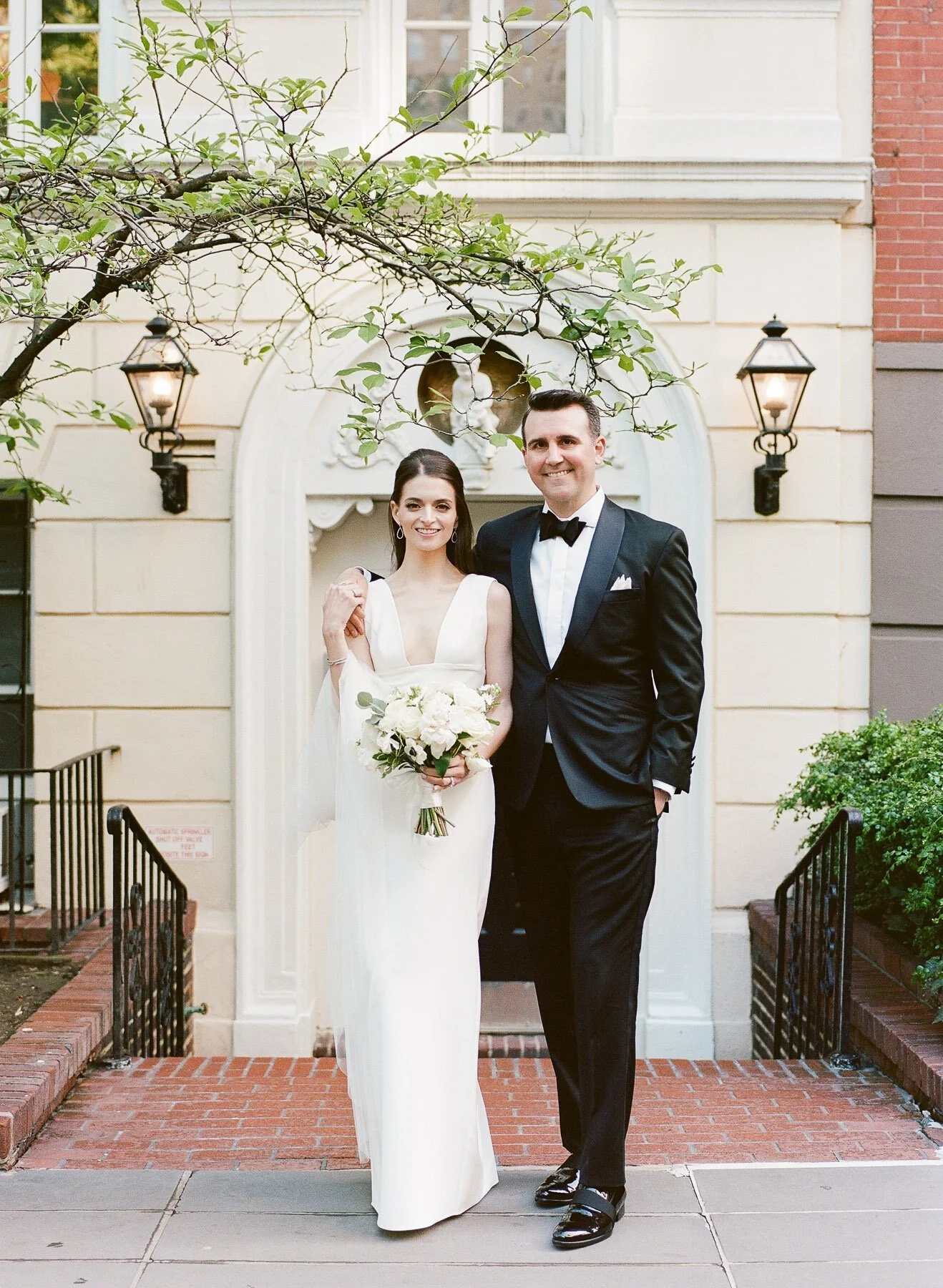 Gramercy Park wedding photos featuring Sarah Seven wedding dress and Tom James Tux