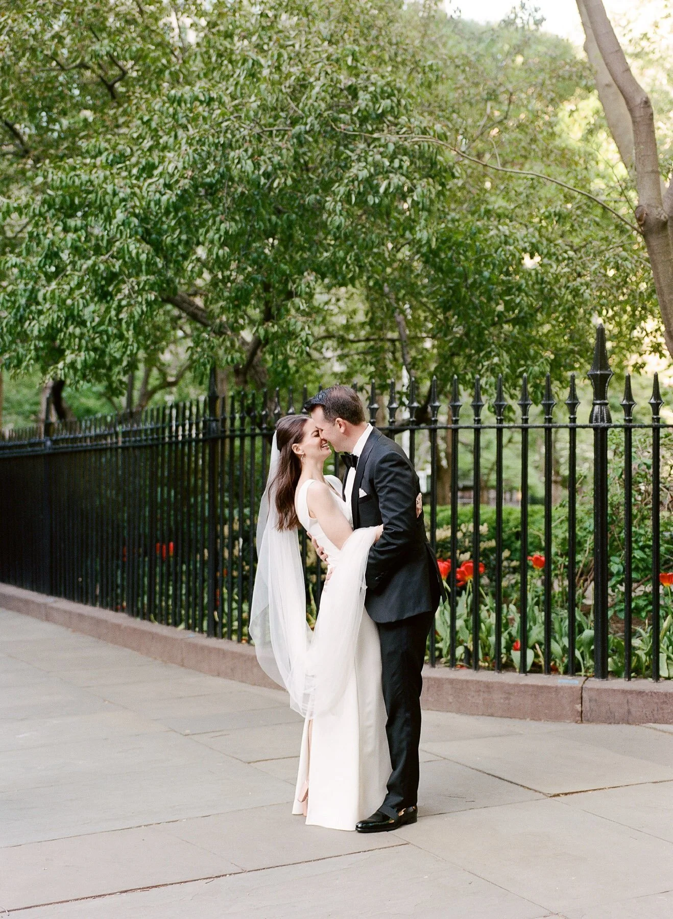 Gramercy Park wedding photos featuring Sarah Seven wedding dress and Tom James Tux
