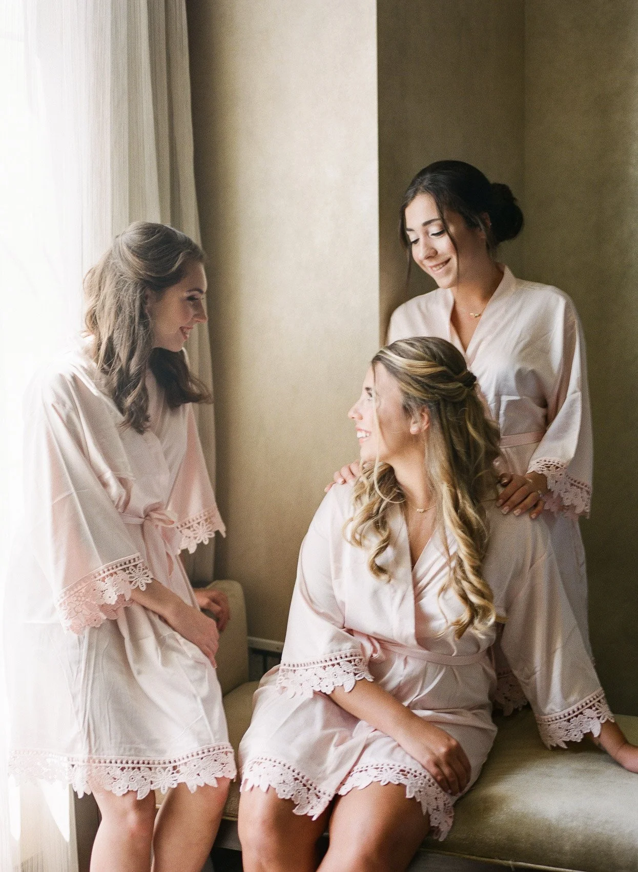 Bridemaids hanging out on wedding day