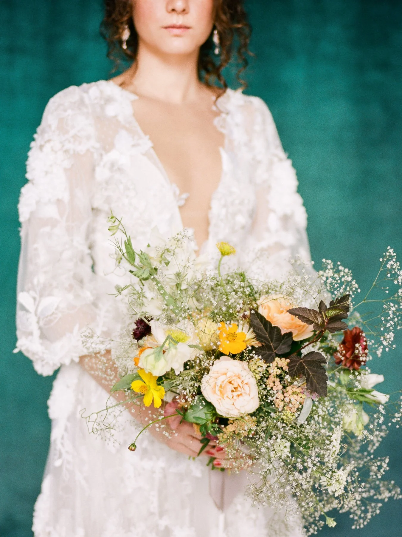 Baby's breath wedding bouquet and Marchesa wedding gown