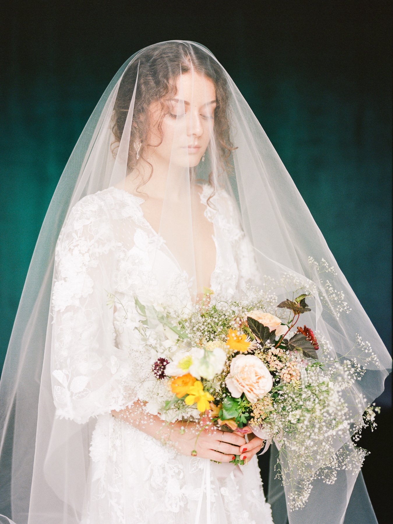 Baby's breath wedding bouquet and Marchesa wedding gown