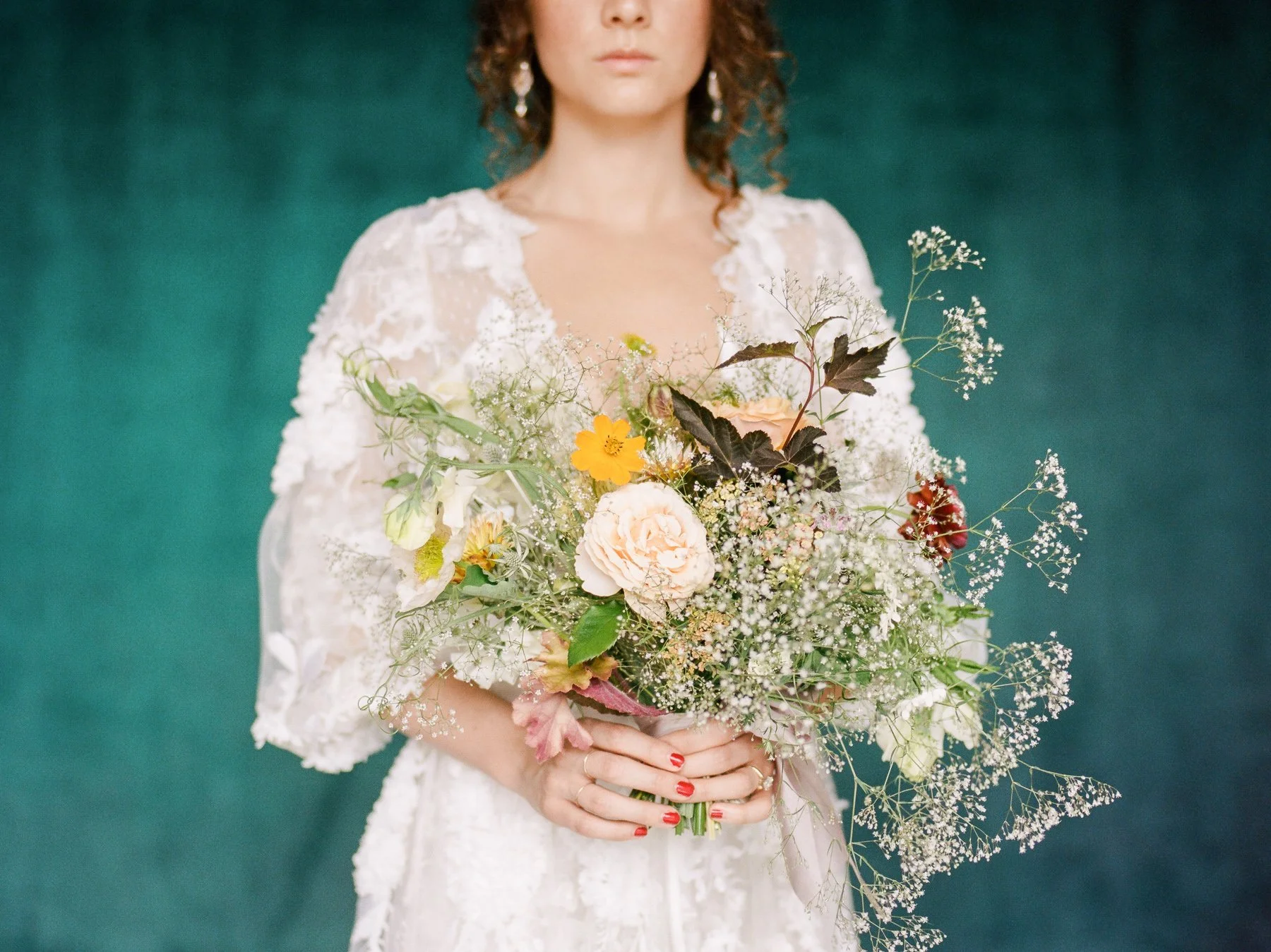 Baby's breath wedding bouquet and Marchesa wedding gown