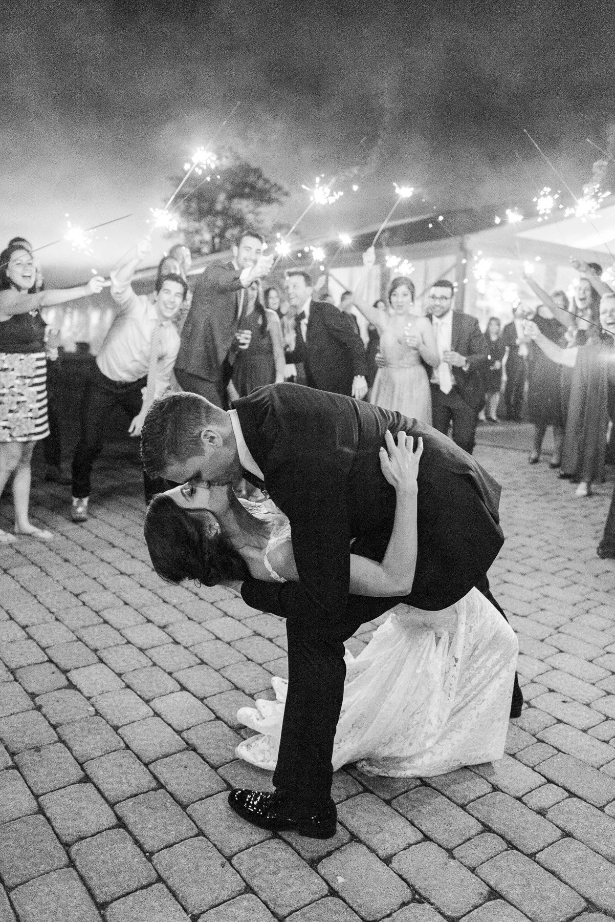 Sparkler Exit Kissing Photo