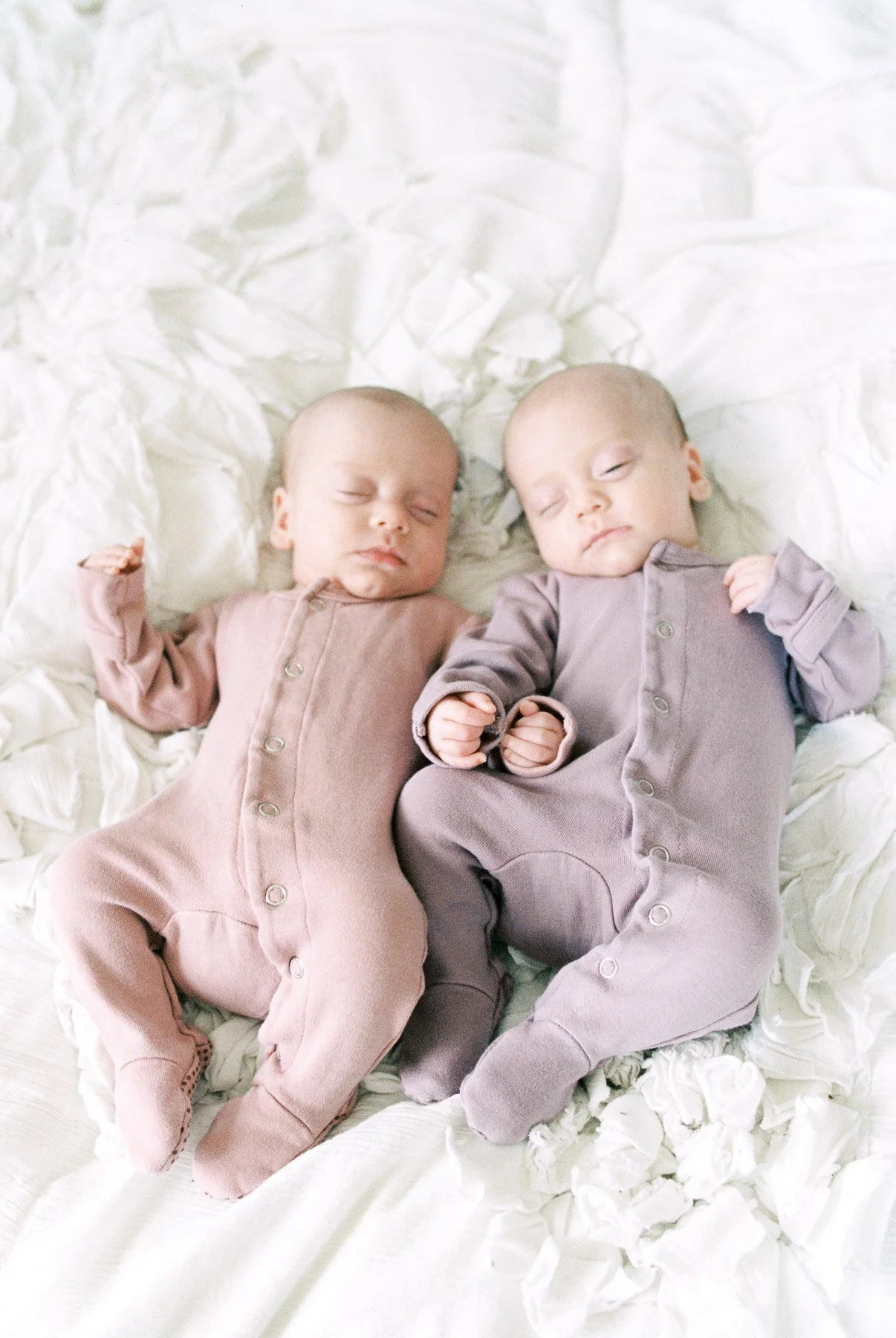 Twin Newborns wearing L'oved Baby Gloved Overalls