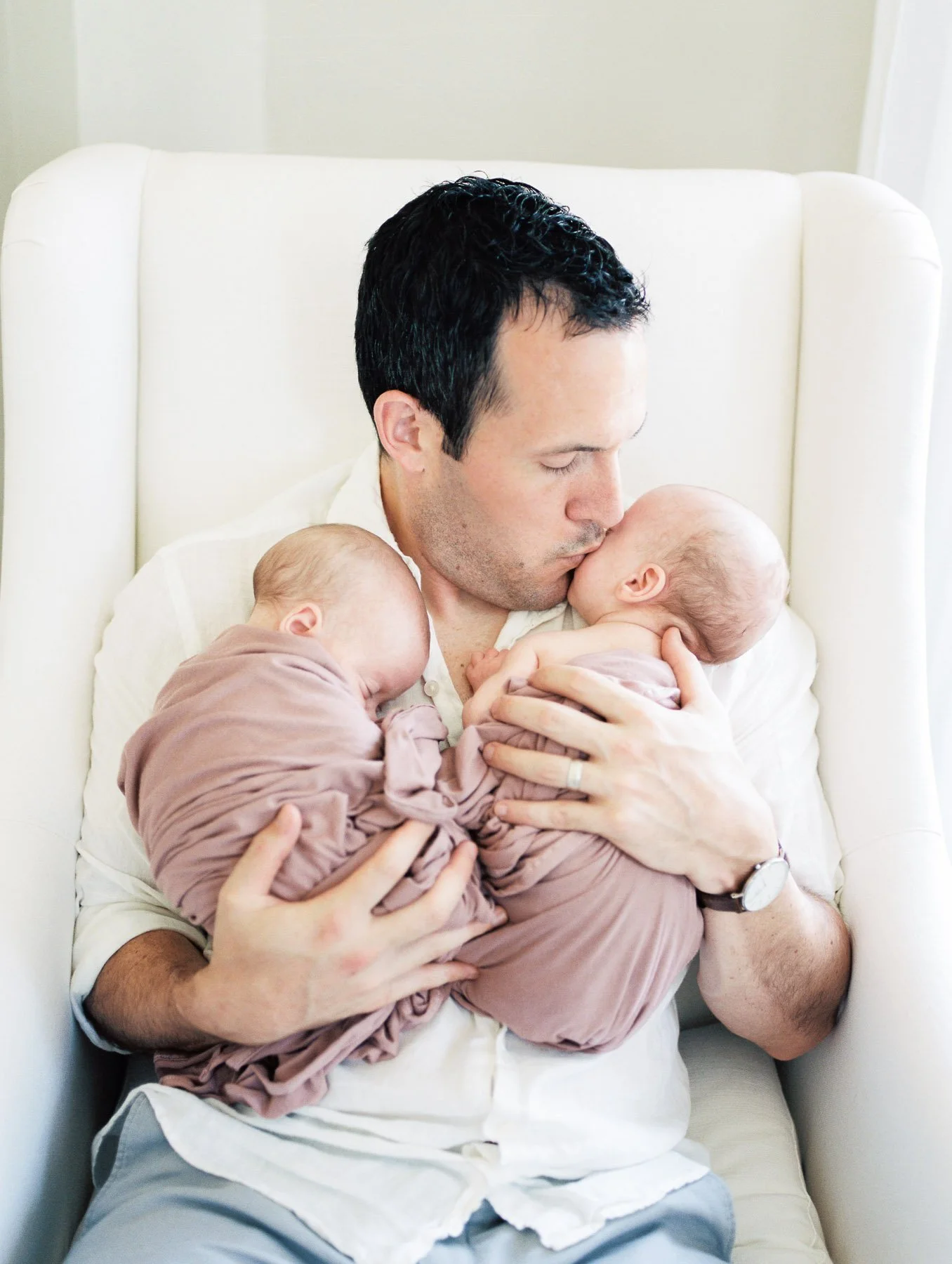 Father kissing baby girl 