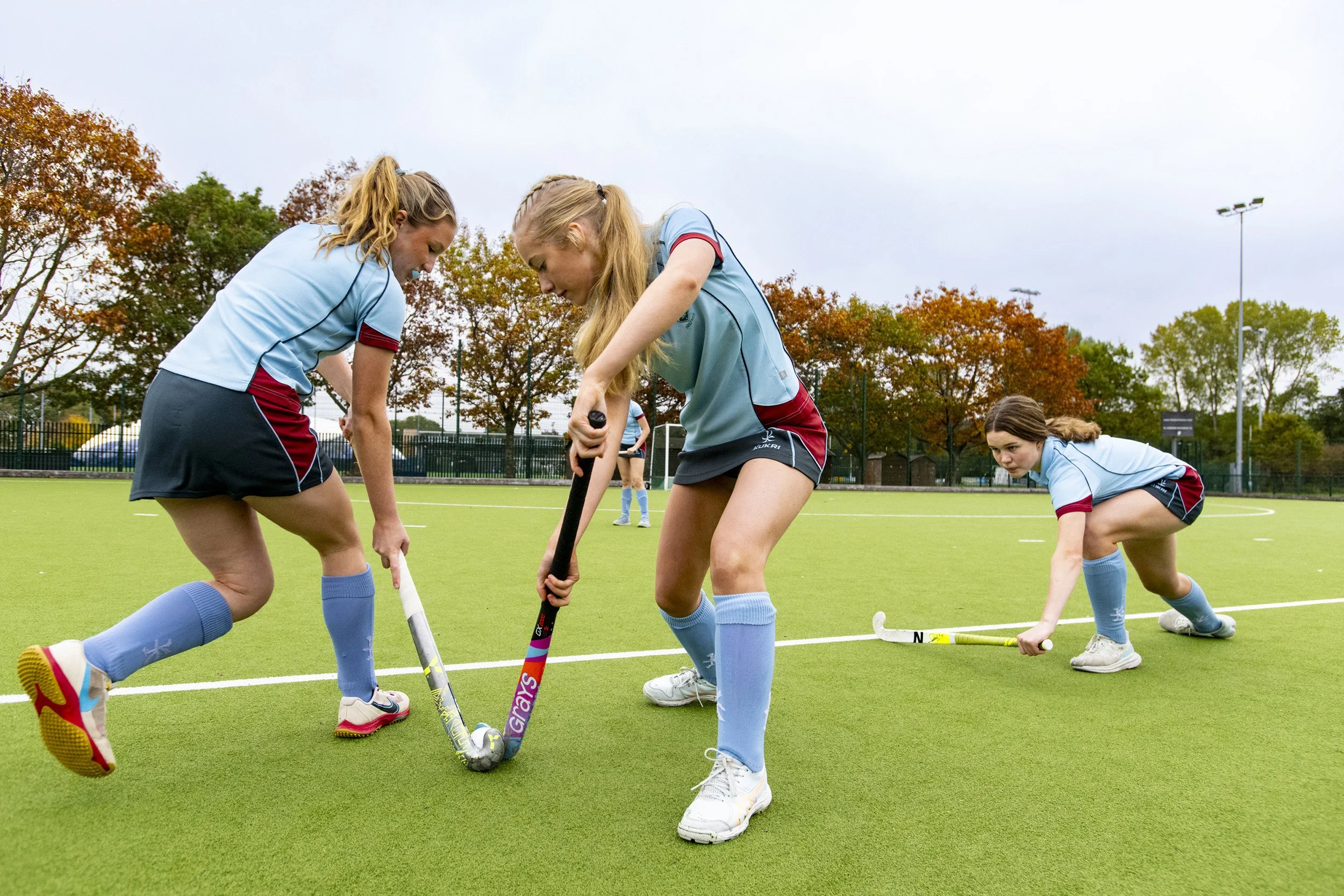 Pupils playing hockey