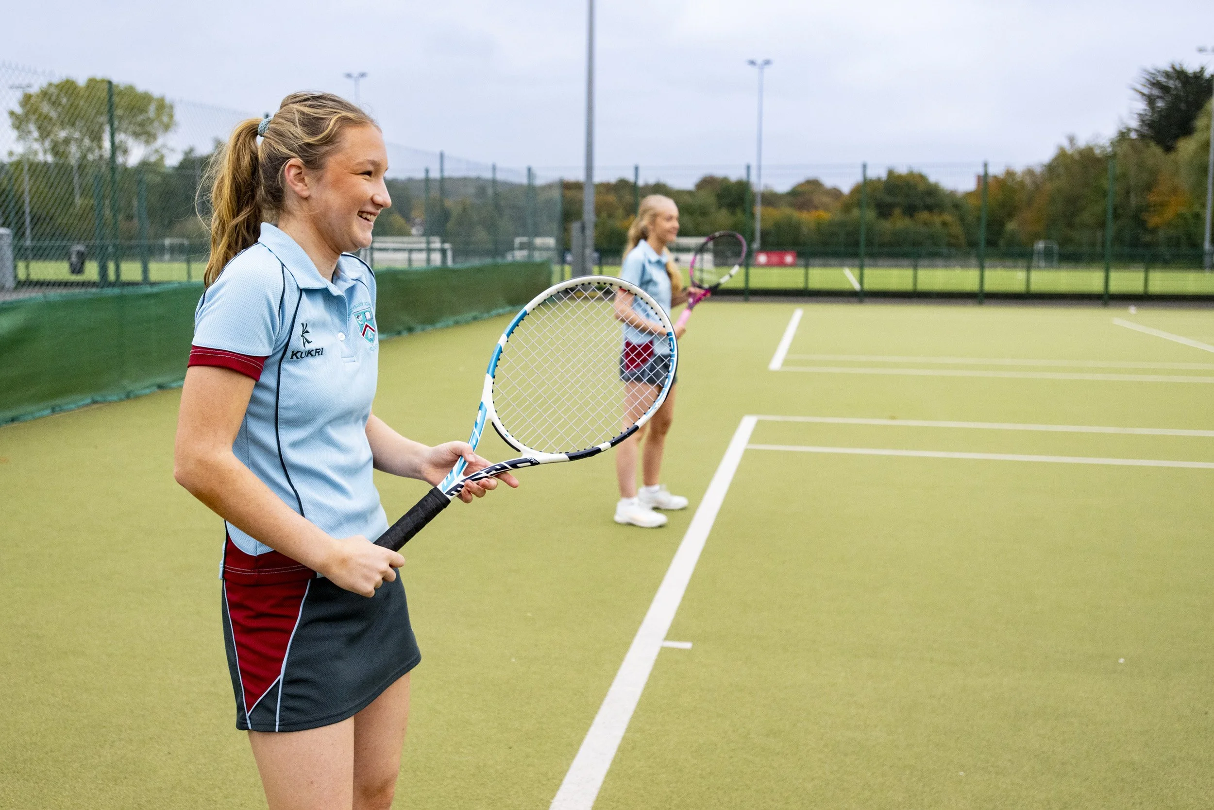 Pupils playing tennis