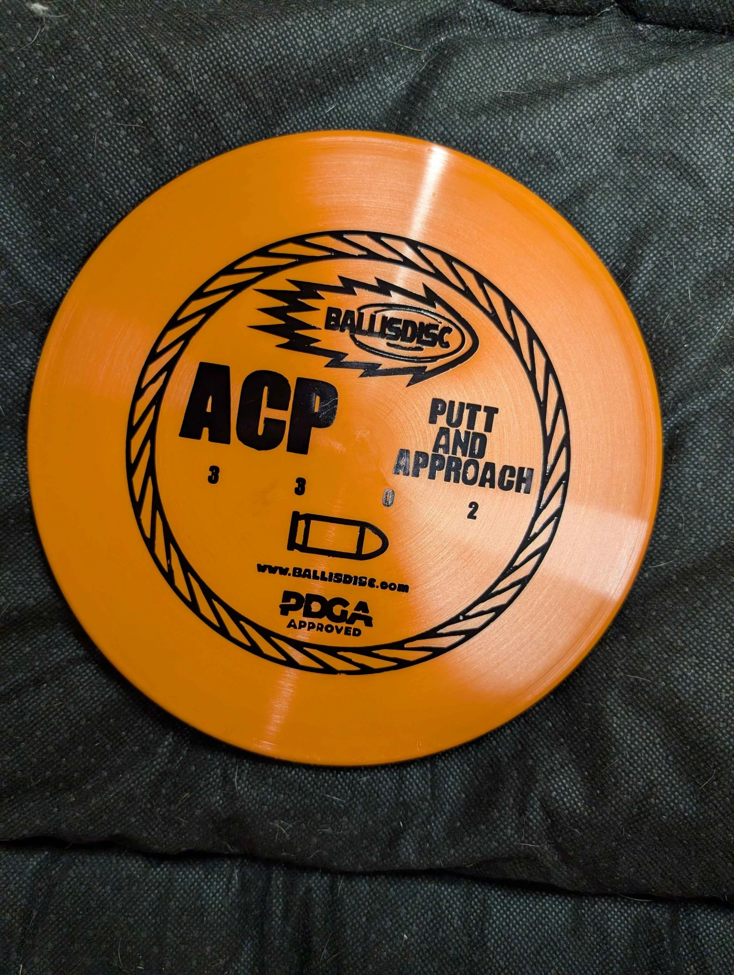 orange disc black stamp.jpg