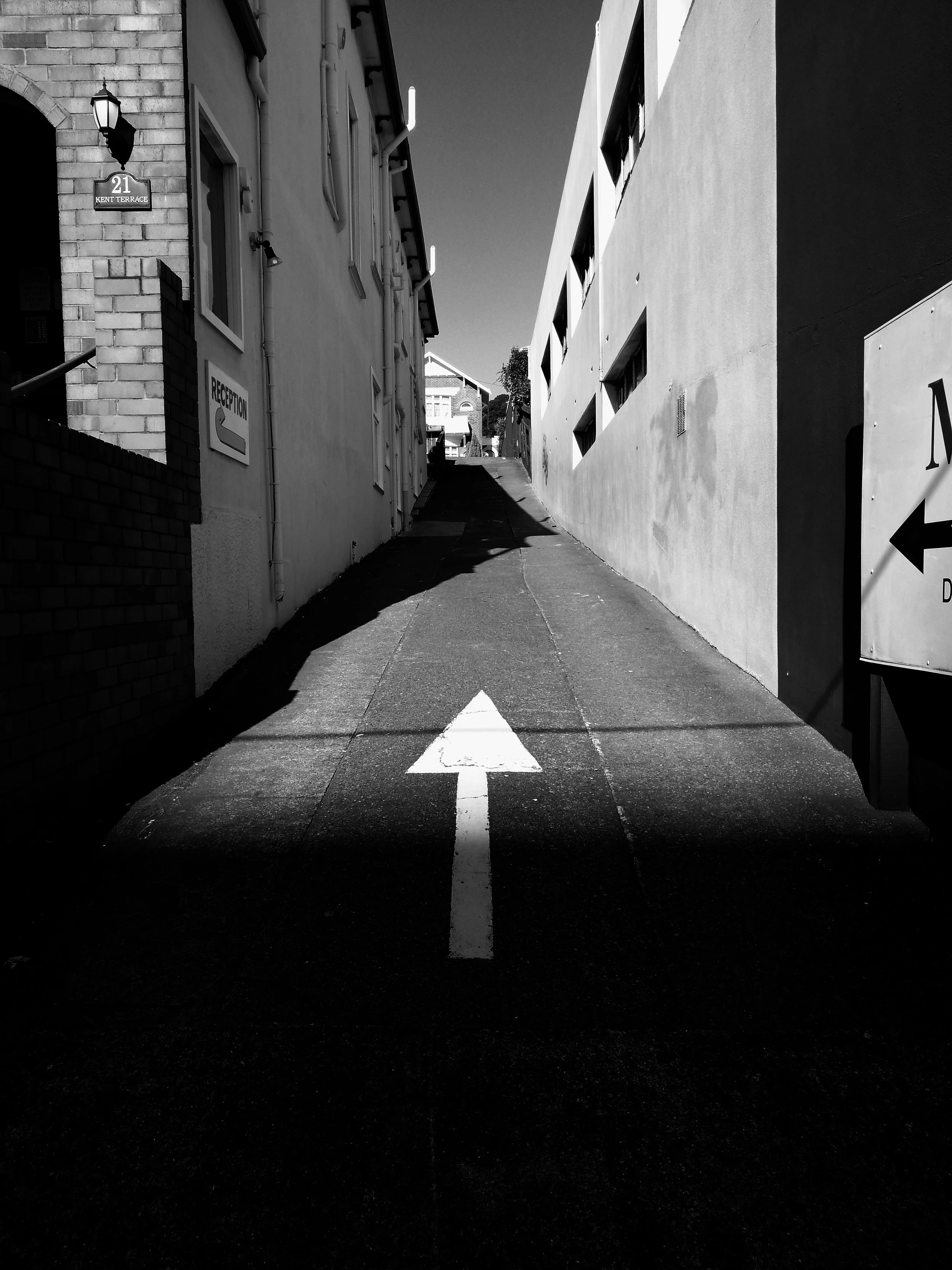 image of an alley with arrow point up on street