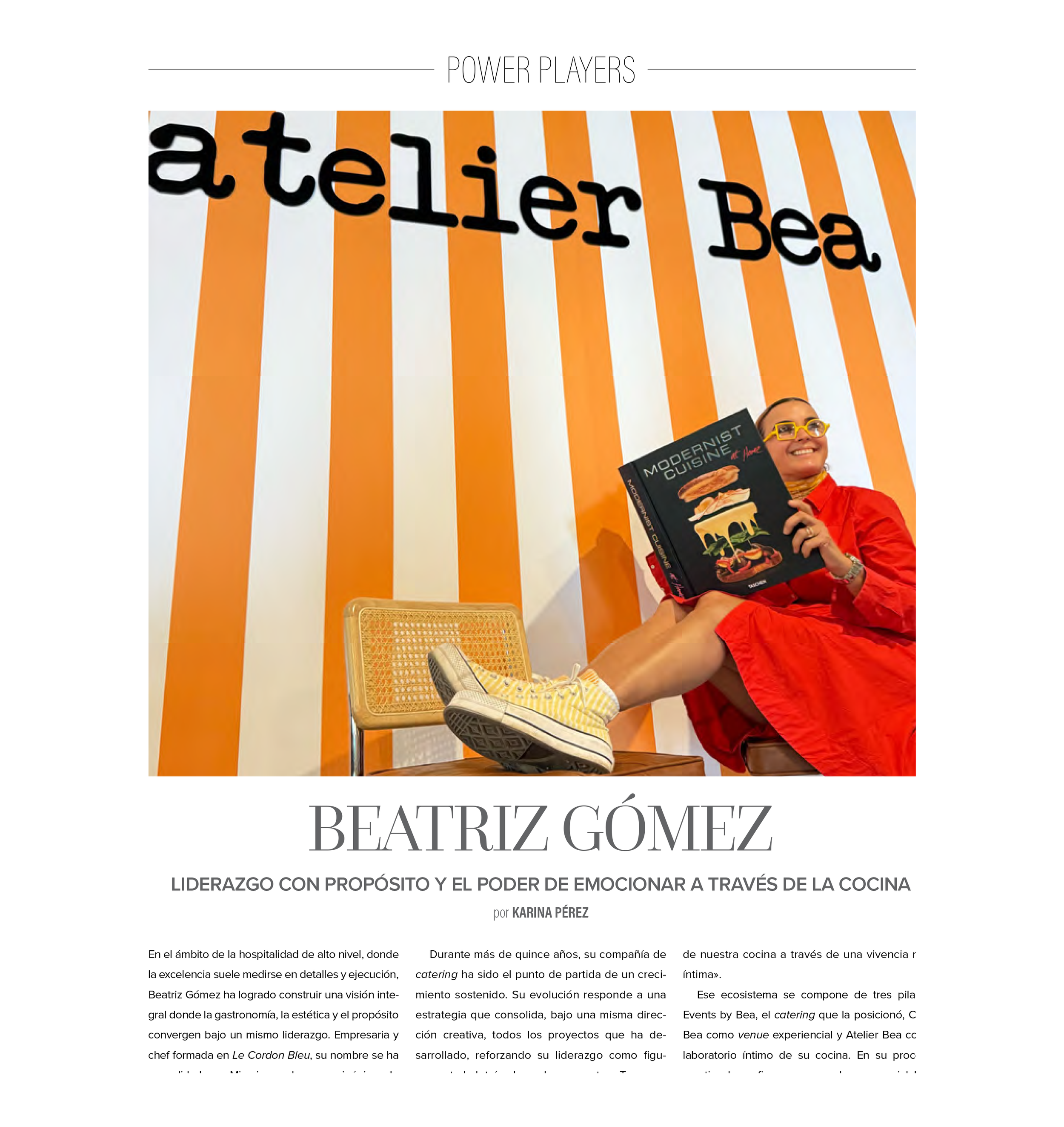A woman sitting on a chair, smiling, holding a cookbook titled "Modernist Cuisine," wearing a red dress and yellow sneakers, with an orange and white striped background and large black text that reads "a teller Be."