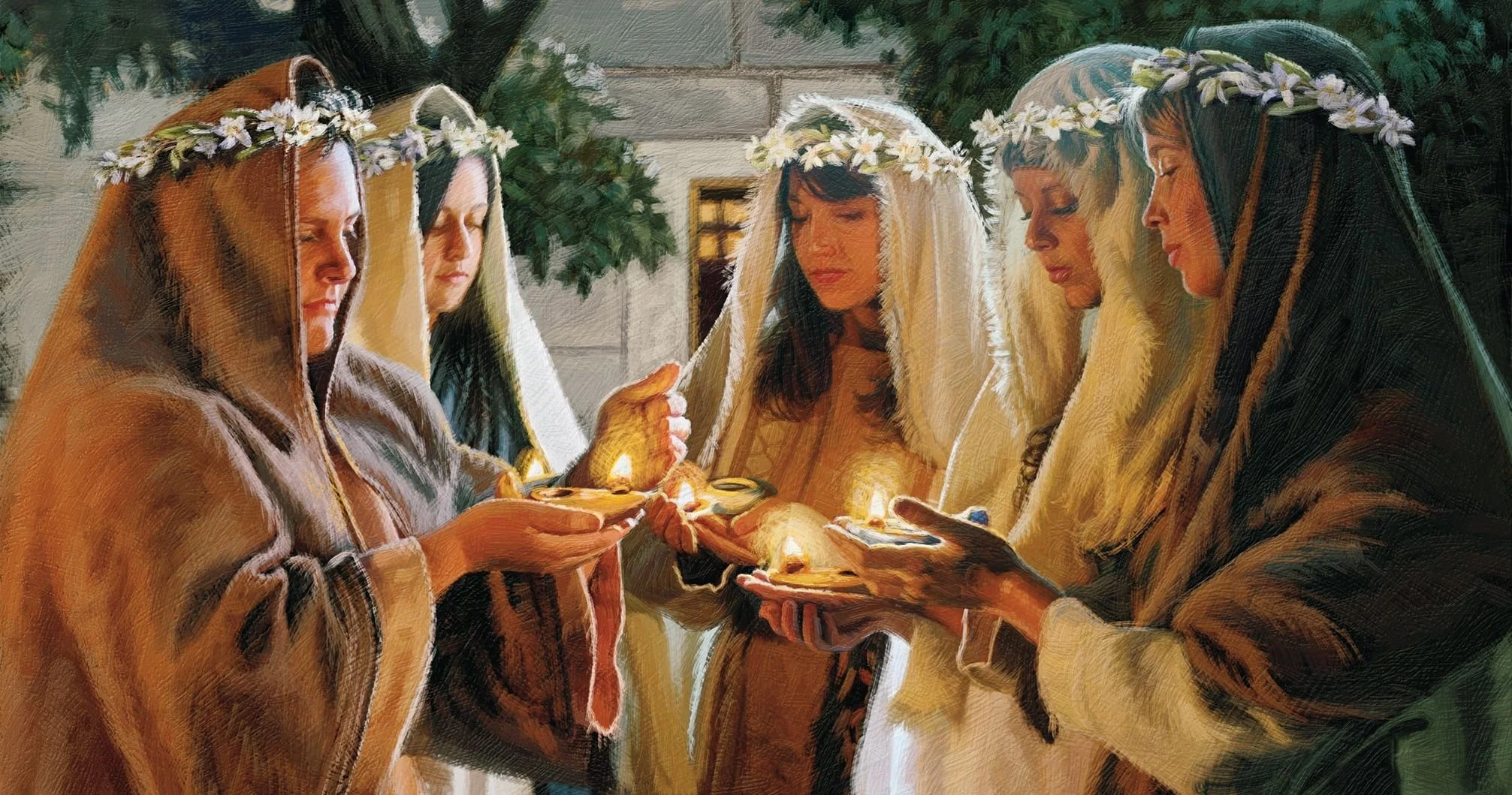 Five women dressed in biblical costumes with flower crowns and veils participate in a Christian ritual or prayer outdoors, holding lit candles and plates.