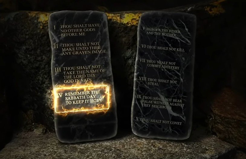 Two stone tablets with Ten Commandments inscribed, one highlighted with a glowing effect stating 'Remember the Sabbath Day to keep it holy.'