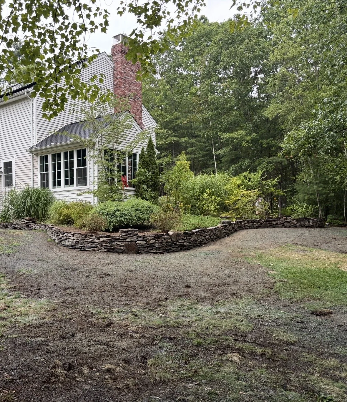 Natural flat stack wall with elevated bed - Pembroke NH
