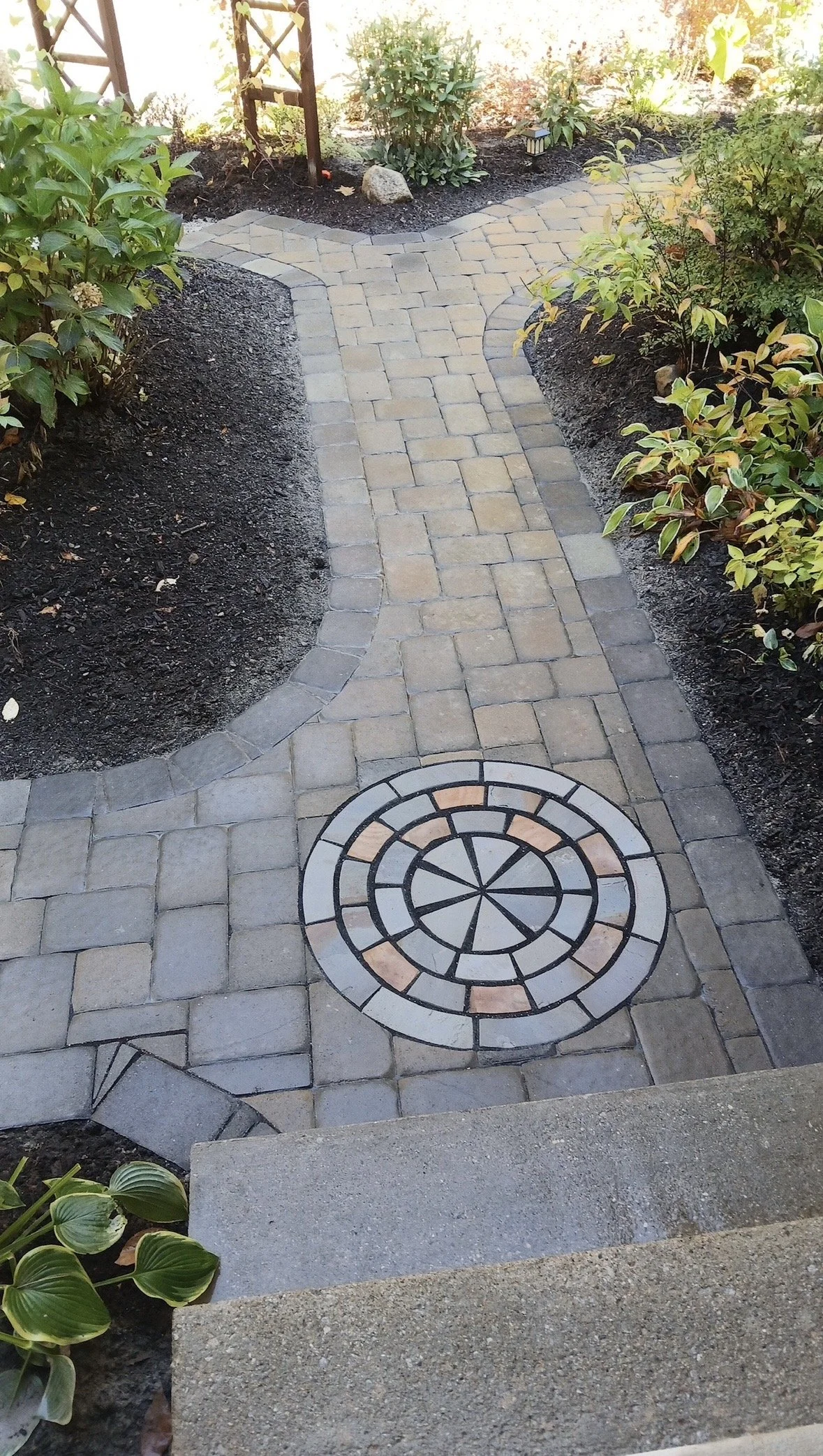Hand cut circle pattern in walkway - Pembroke NH