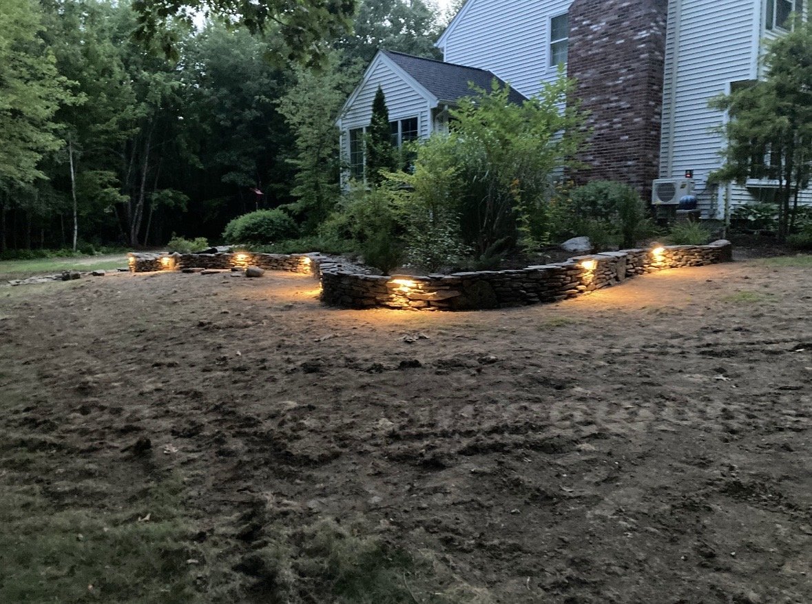Natural flat stack stone wall with incorporated solar lights - Pembroke NH
