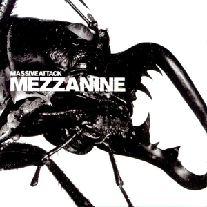 Close-up black and white image of a beetle with large mandibles. Text reads 'MASSIVE ATTACK MEZZANINE.'
