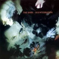 Album cover featuring a woman's face with flowers, butterflies, and abstract dark background, titled 'Disintegrating' by The Cure.