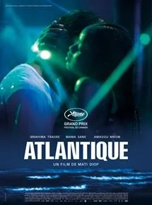 A poster for the film 'Atlantique' by Mati Diop, featuring a silhouette of a couple embracing with a blue-toned background and the title text.