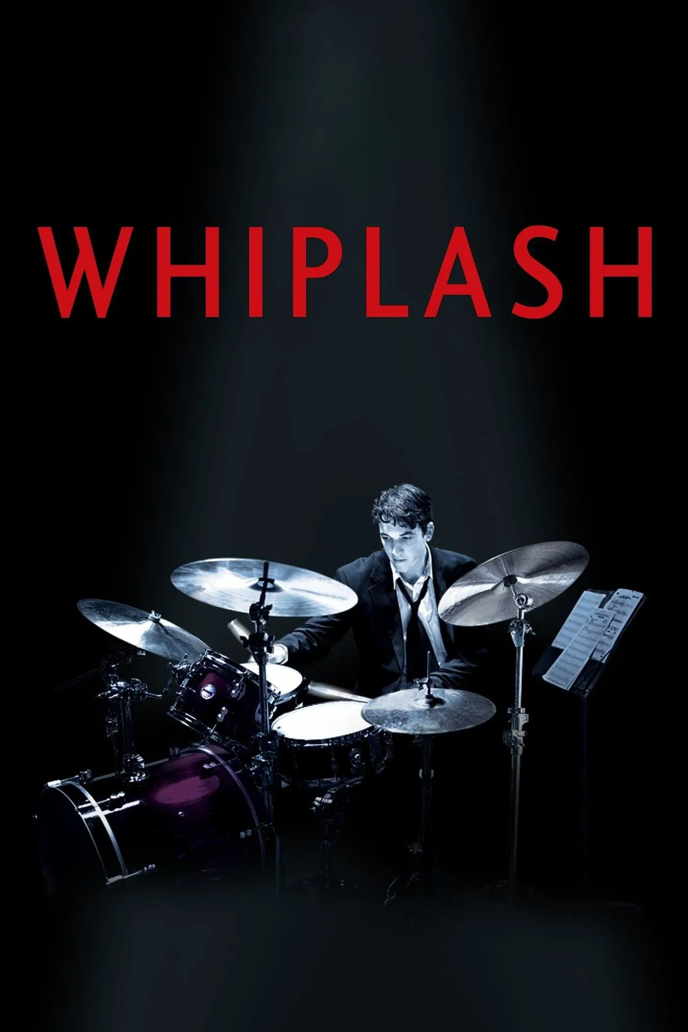 Movie poster for 'Whiplash', showing a man playing drums under a spotlight with the title in large red letters above him.
