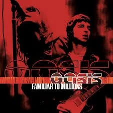 The cover of an album titled "Familiar to Millions" by Oasis, featuring a red-tinted photo of band members with one playing a guitar.