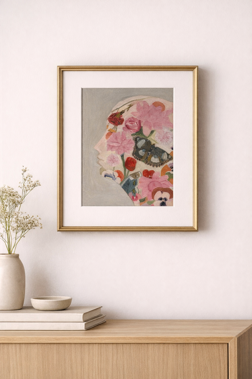 Floral silhouette artwork on minimalist console table.png