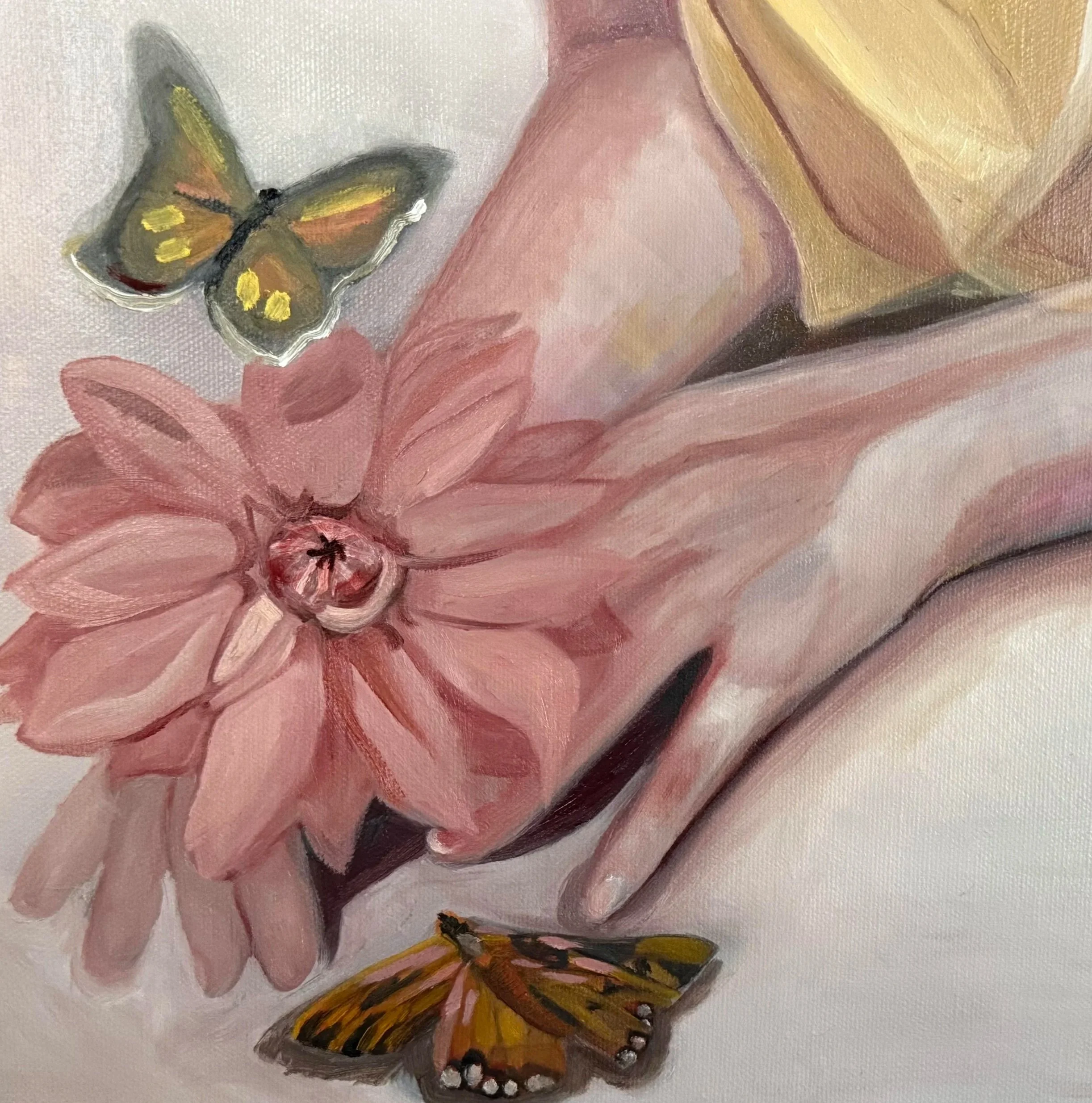 Close-up of a painting depicting a hand with flowers, and butterflies flying around, with a soft, warm color palette.