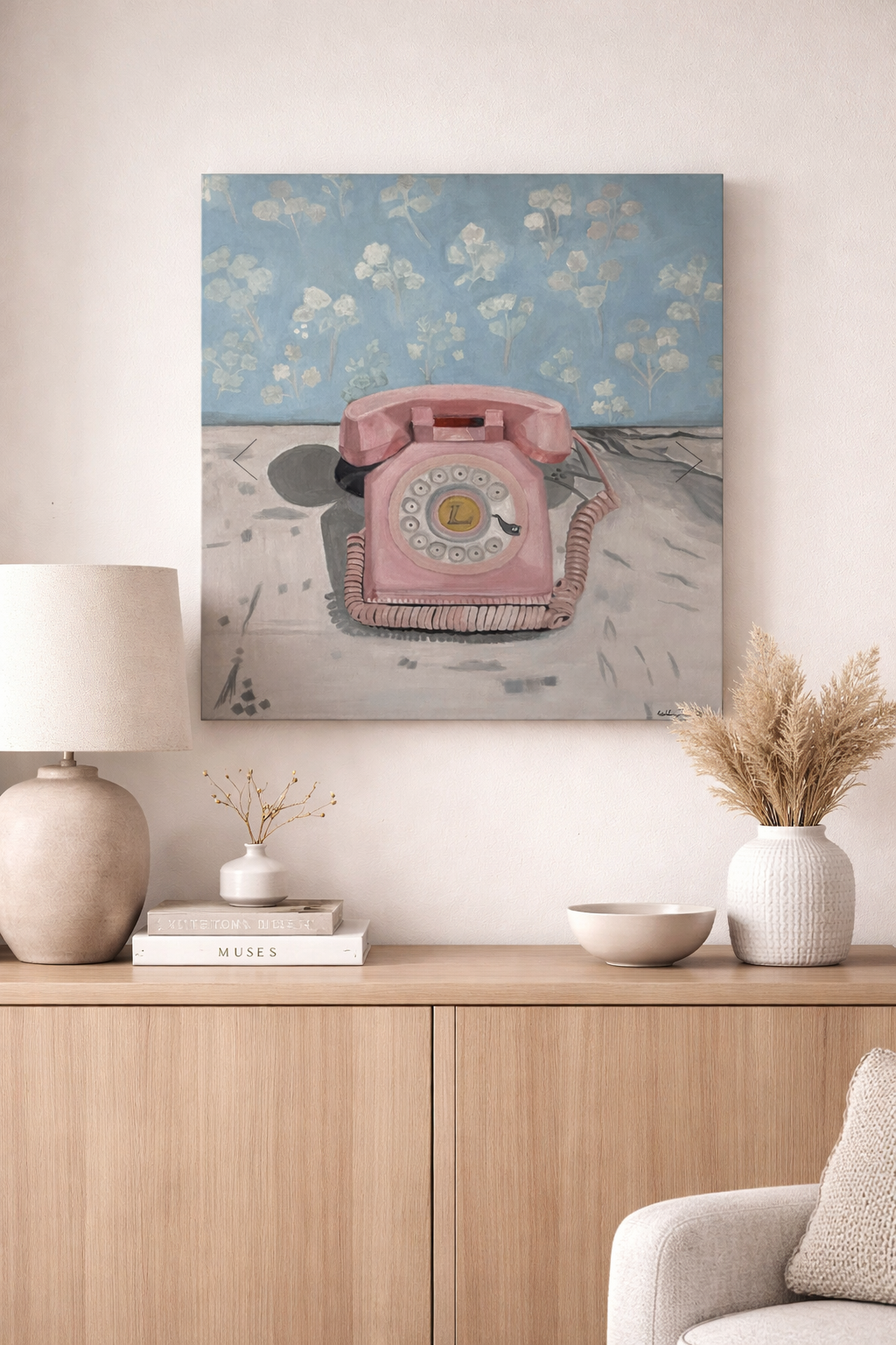Vintage pink phone on painted wall.png