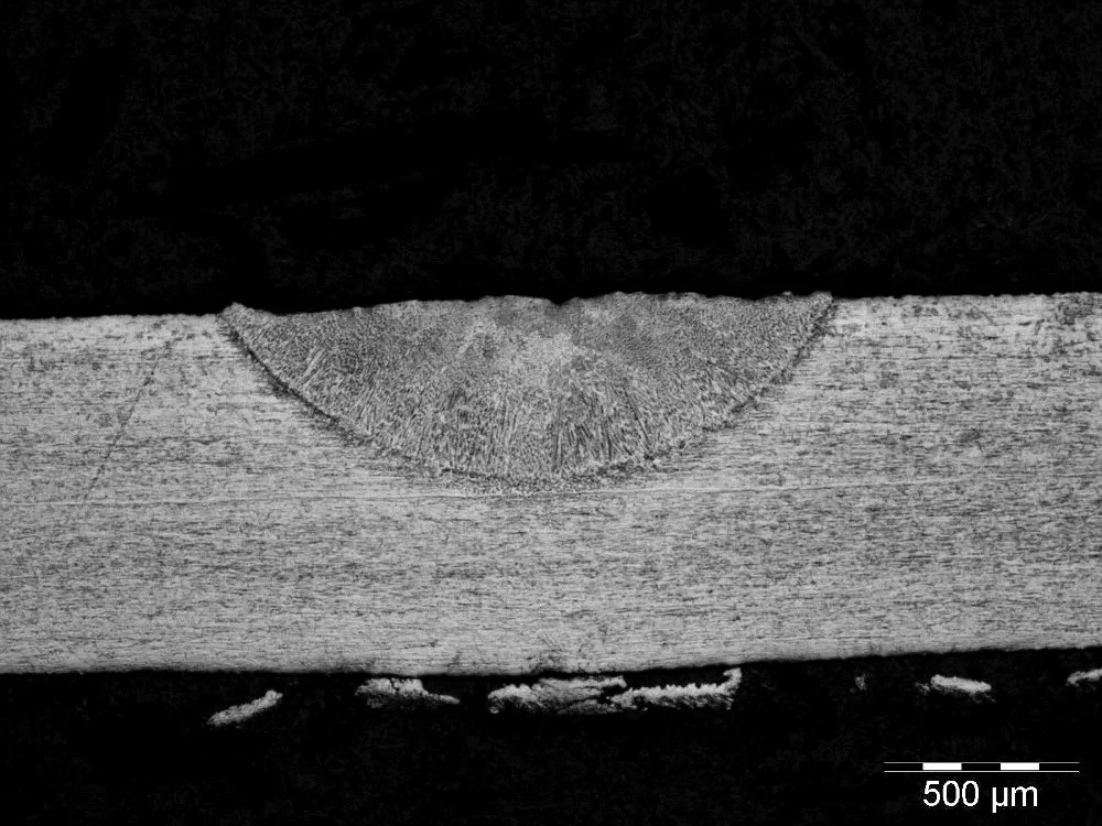 Conduction-limited laser weld bead in 316 stainless steel, etched with Kalling's No.2 reagent.