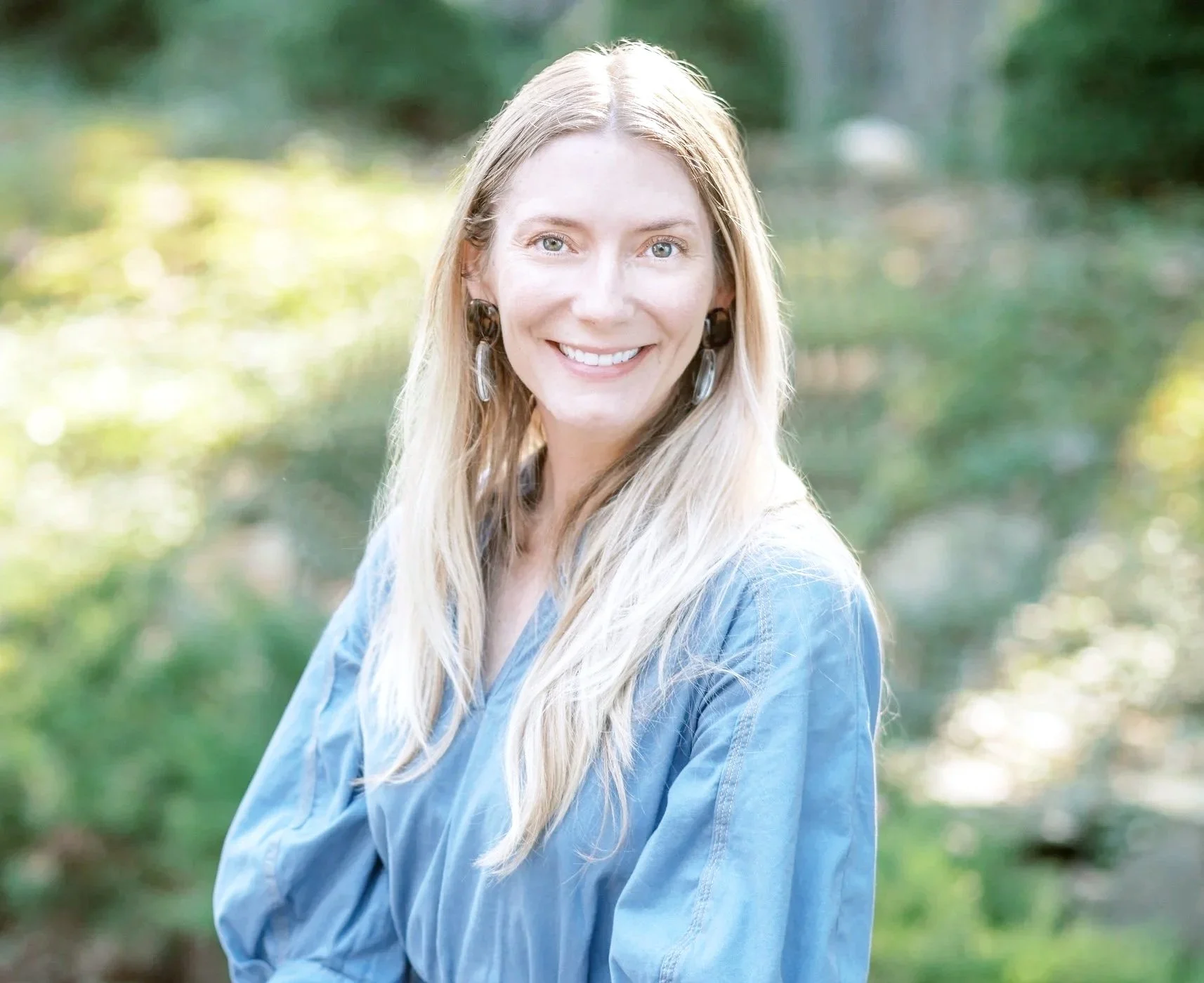 Caitlin Wick, licensed therapist in Providence RI, smiling warmly