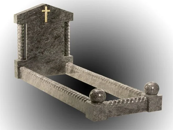 Grey granite kerb memorial with a gold cross on top, two carved columns, and kerbing with barley twist decorations.