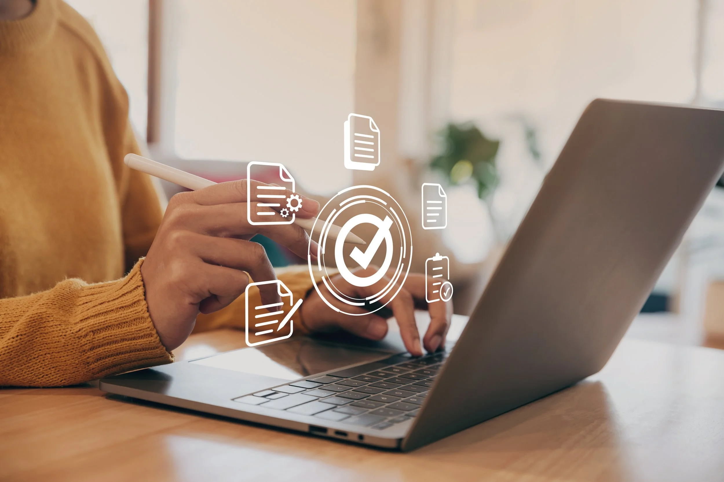 Language professional using a laptop with digital quality control and document verification icons.