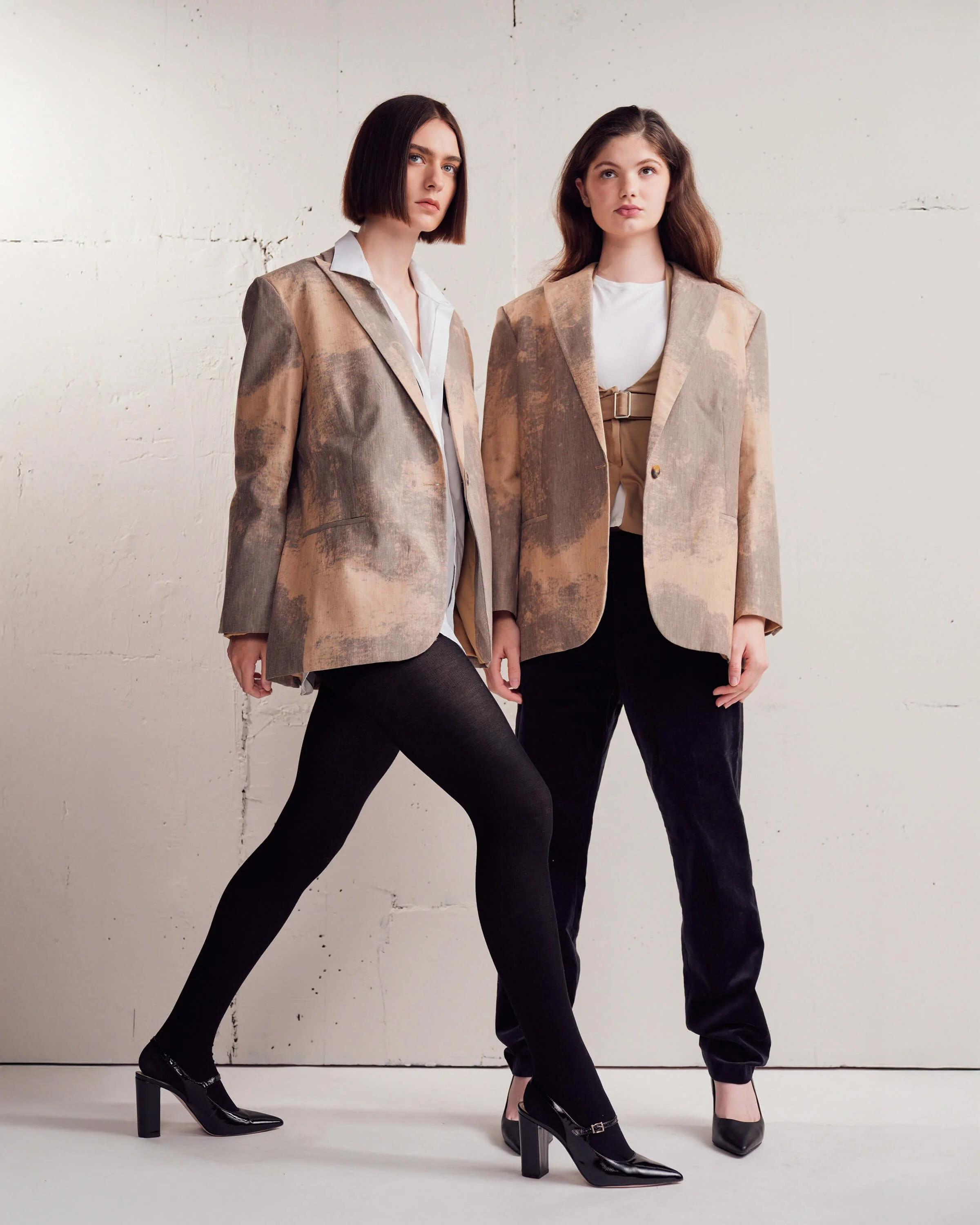 (two women in blazers against wall) Best Advertising campaign photography Minneapolis - Krizia Studios