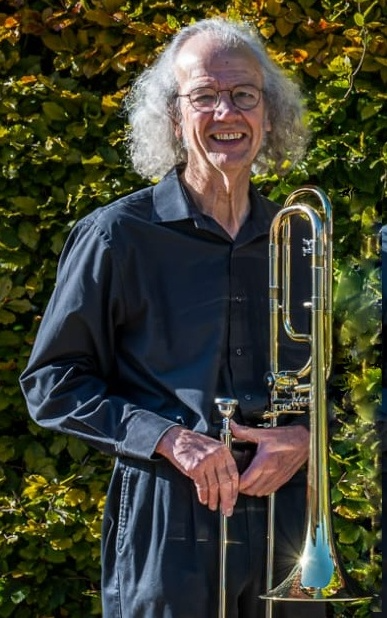 Phil Humphries in the sun with his trombone