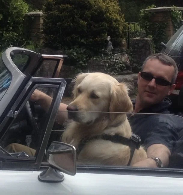 Mark Law in his car with his cute dog