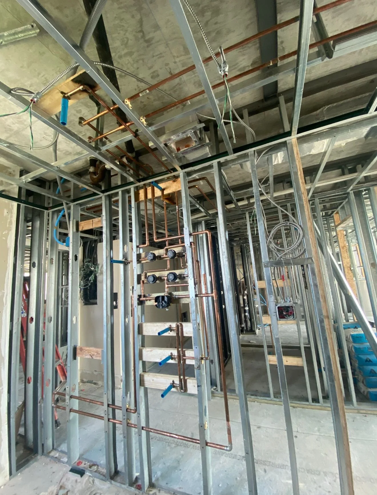 Interior framing for plumbing and electrical installation in a building under construction.