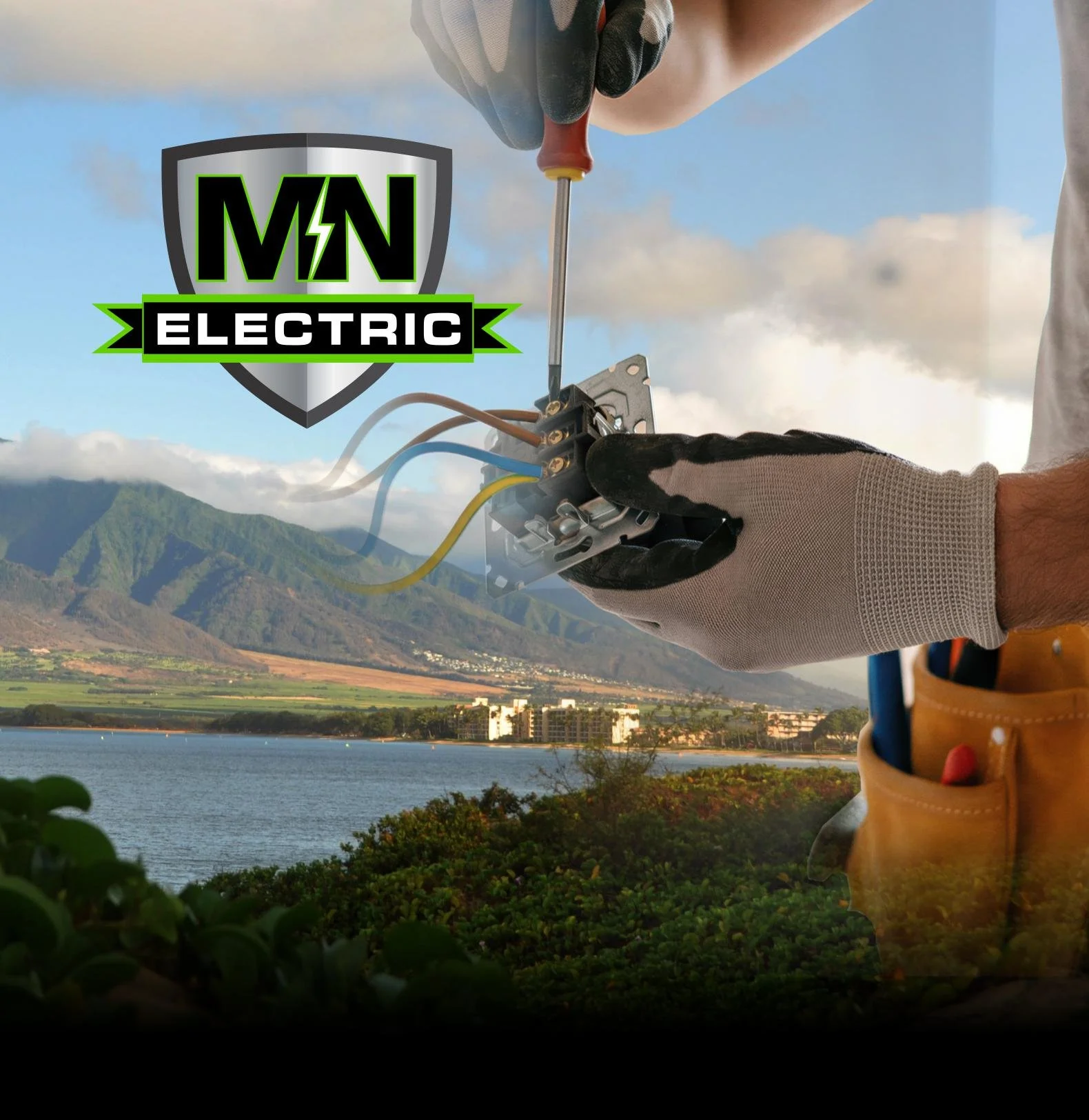 Person installing or repairing an electrical outlet outdoors with a scenic mountain and lake view in the background, and a logo for 'MN Electric'.
