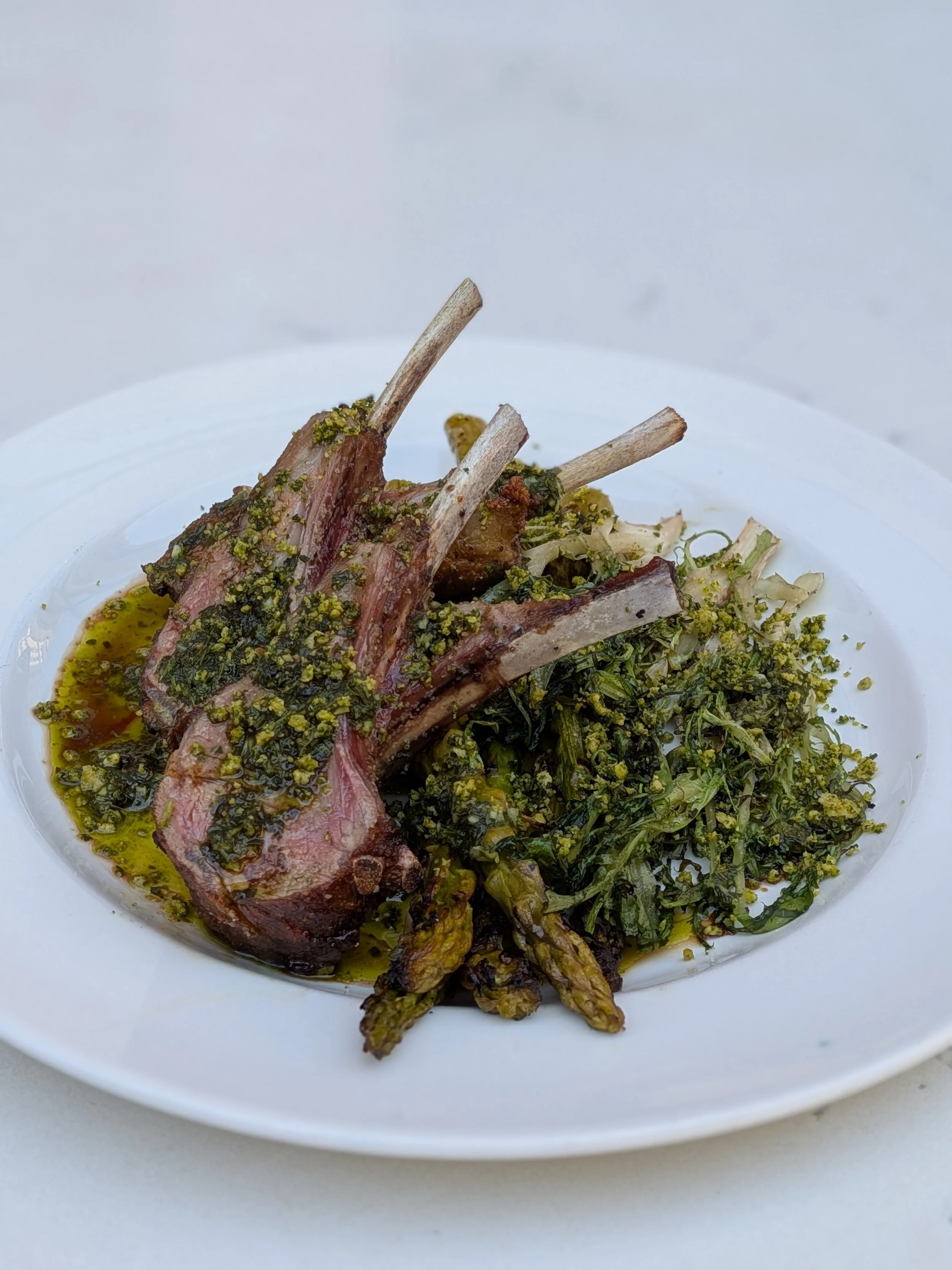 Lamb Chops, Braised Asparagus, Grilled Frisee, Herb Parmesan Crumble, and Garlic Salmoriglio