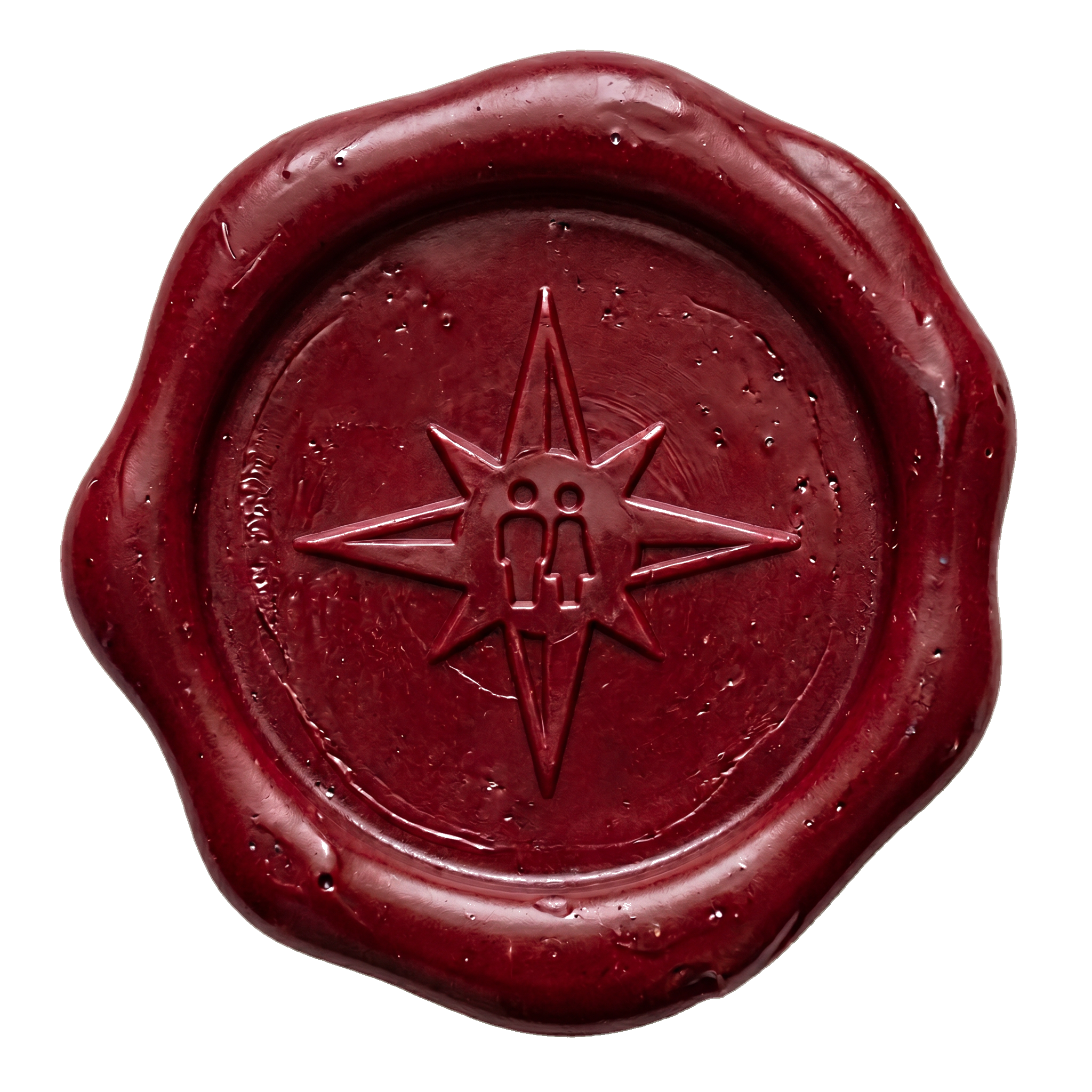 Red wax candle with a carved star and moon design on the top.