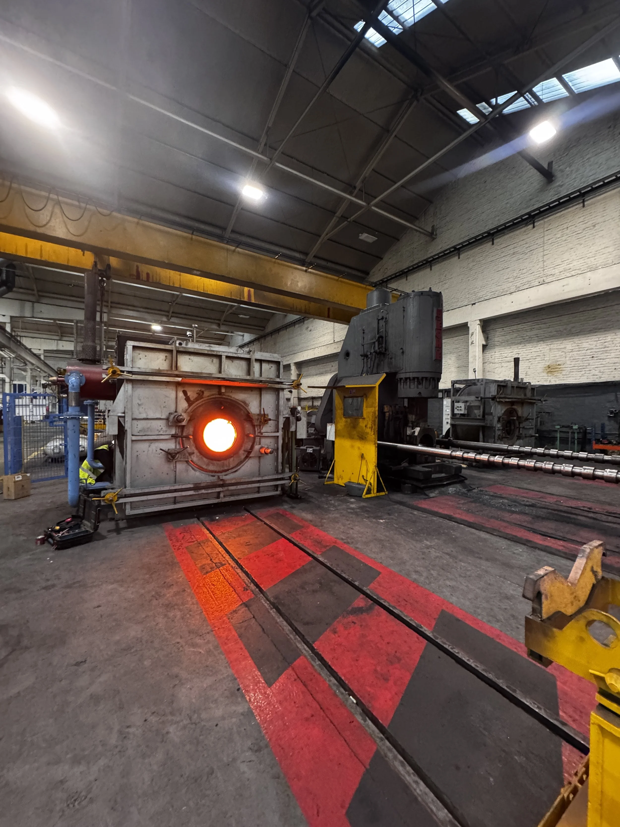 Industrial process heating furnace used in steel gas cylinder production.