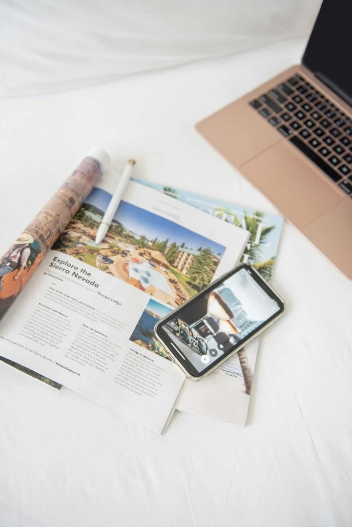 Travel advisor planning a custom European itinerary with maps, travel guides, and notes